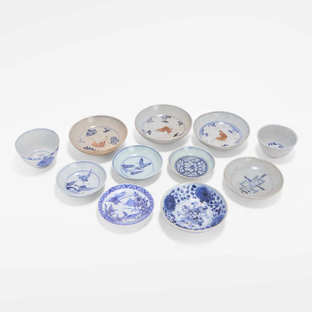 A collection of eleven Chinese blue and white cups and saucers Ming