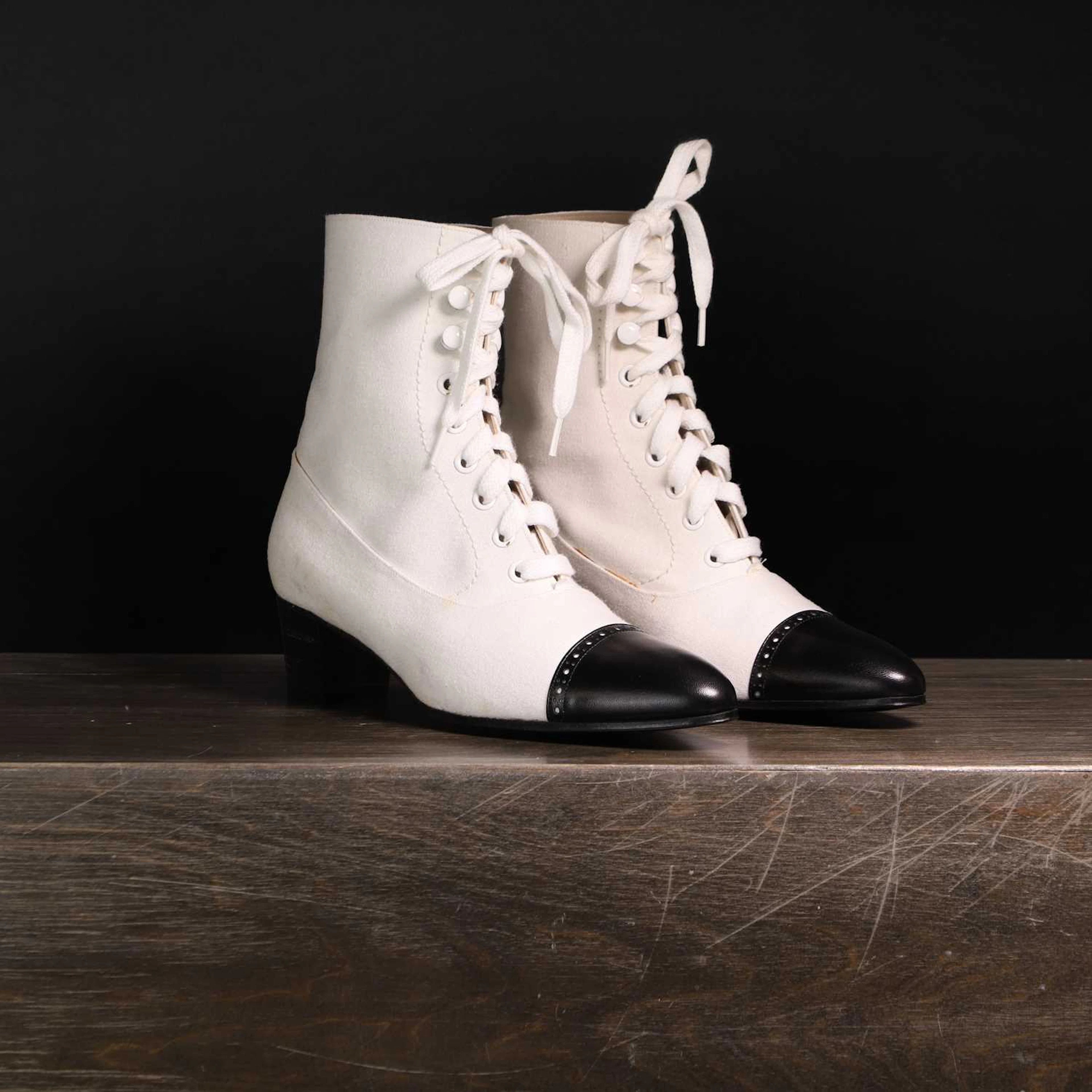A pair of Chanel black and white boots
