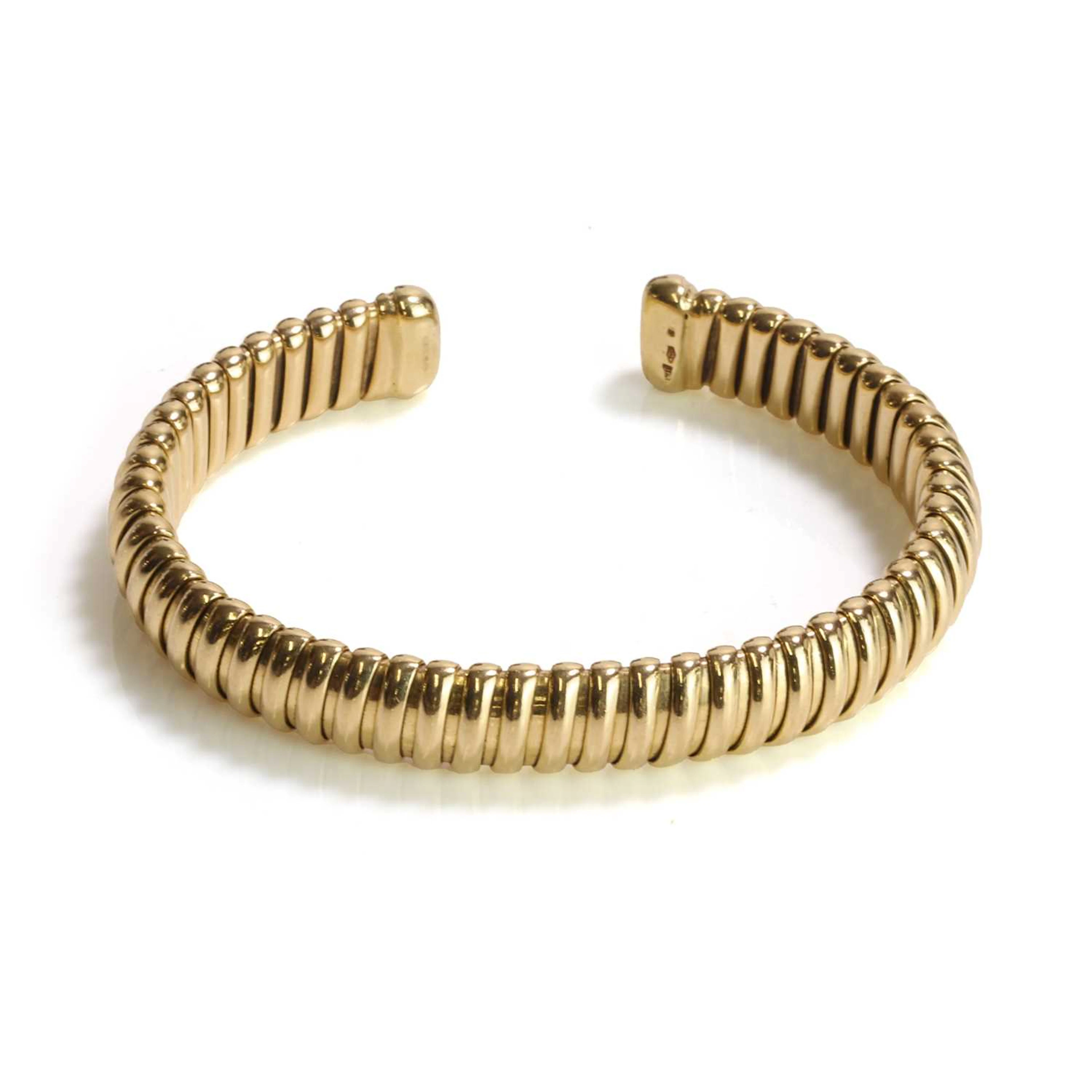 An 18ct gold torque bangle, by Mappin & Webb