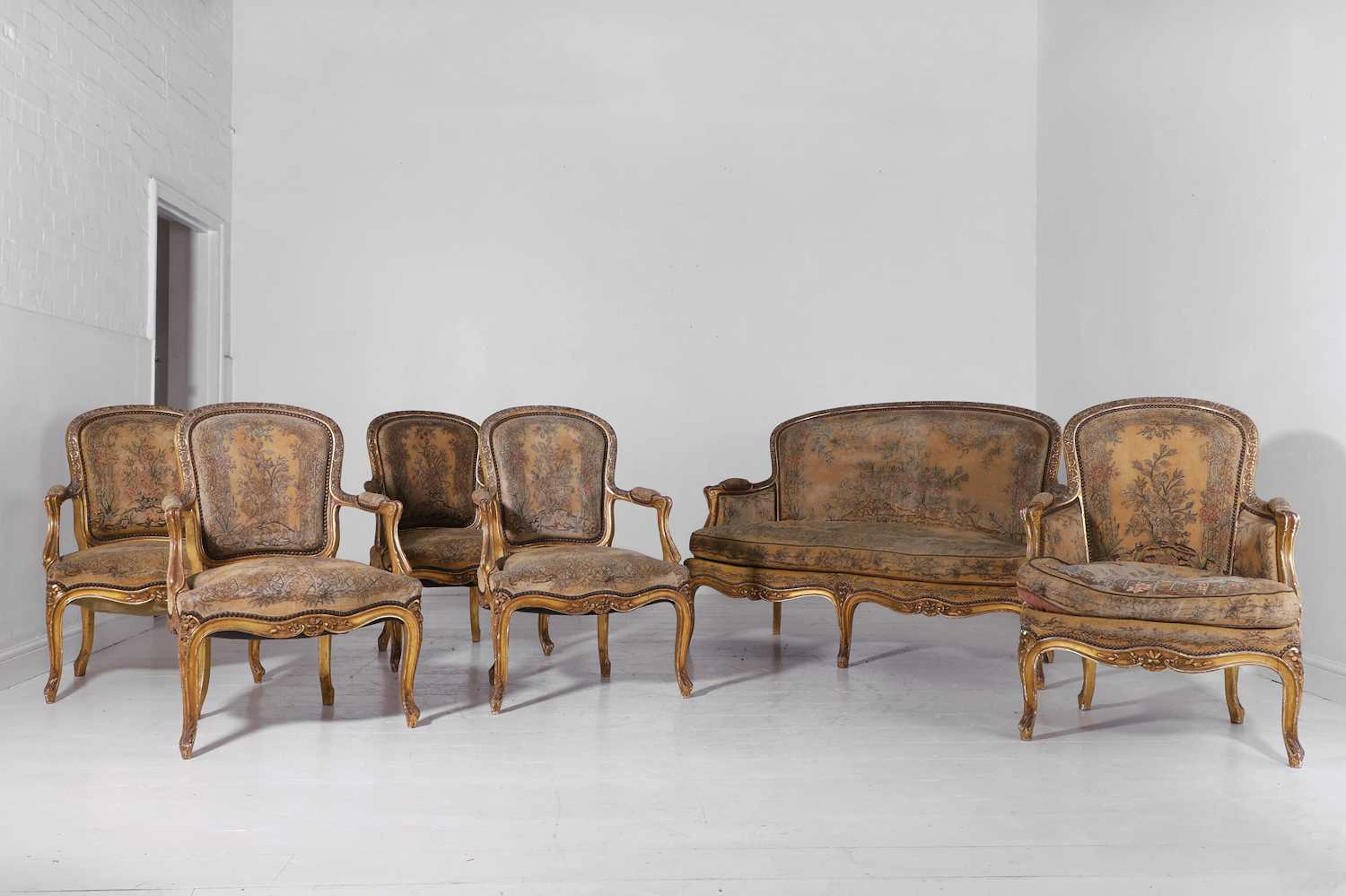 A Louis XV-style giltwood and gesso salon suite