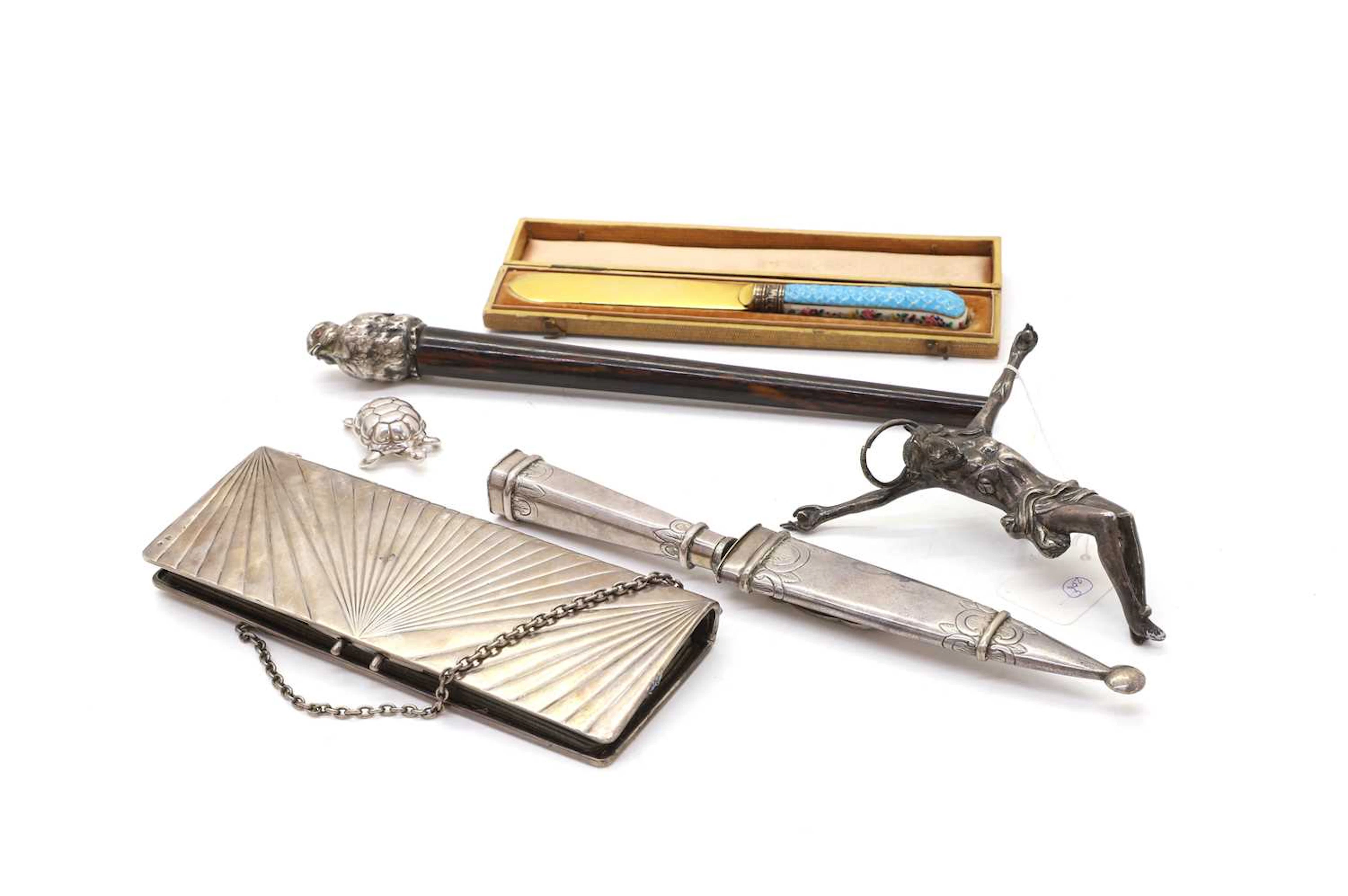 A collection of silver and white metal items