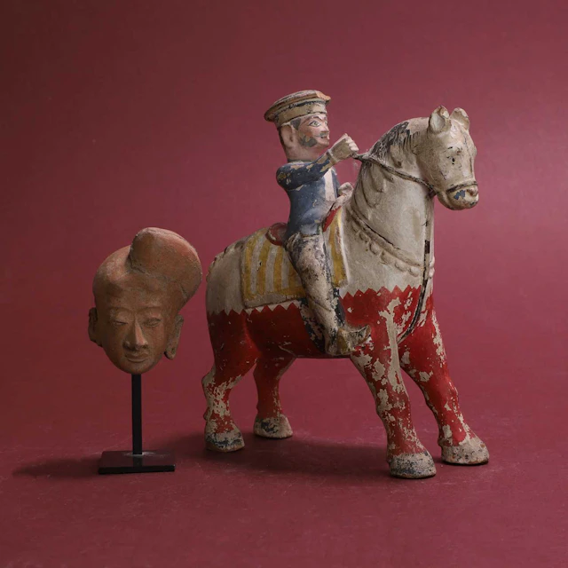 An Indian carved wood figural group of a horse and rider