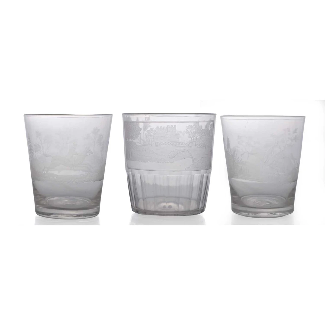 A group of three engraved glass tumblers early 19th century