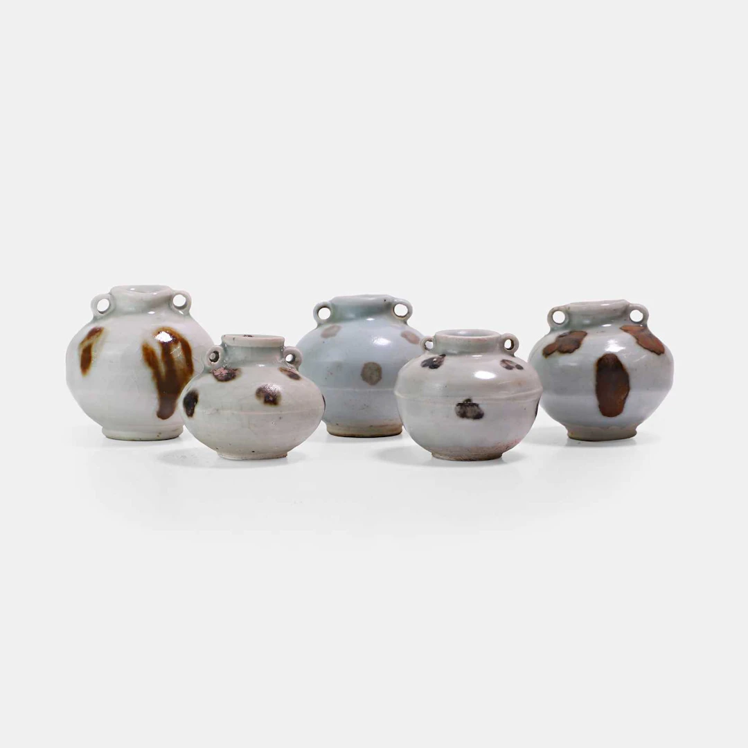Five Chinese iron-spot-decorated qingbai-glazed jarlets Yuan dynasty