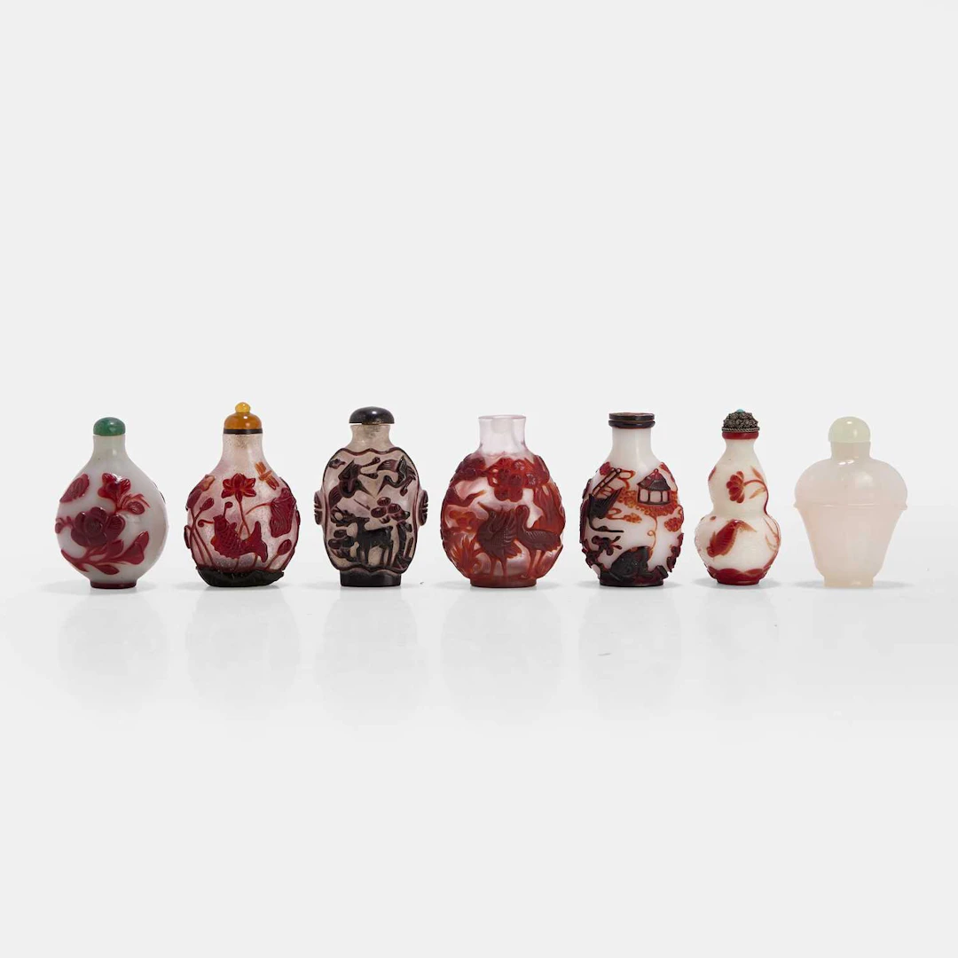 A collection of Chinese overlay Peking glass snuff bottles 19th-20th century