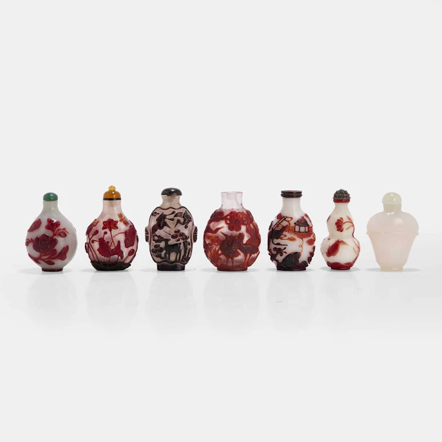 A collection of Chinese overlay Peking glass snuff bottles 19th-20th century
