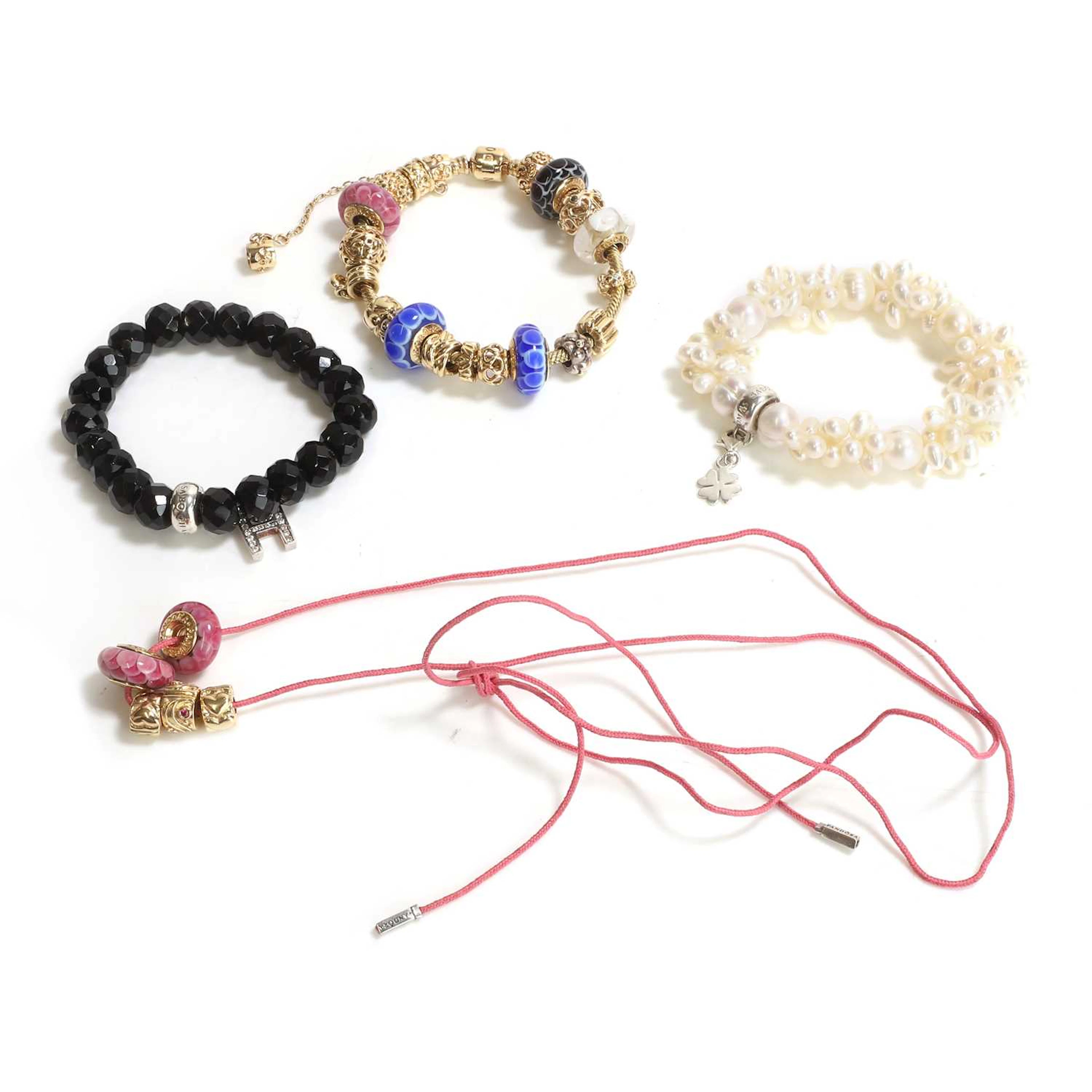 A 14ct gold charm bracelet by Pandora and two bracelets by Thomas Sabo