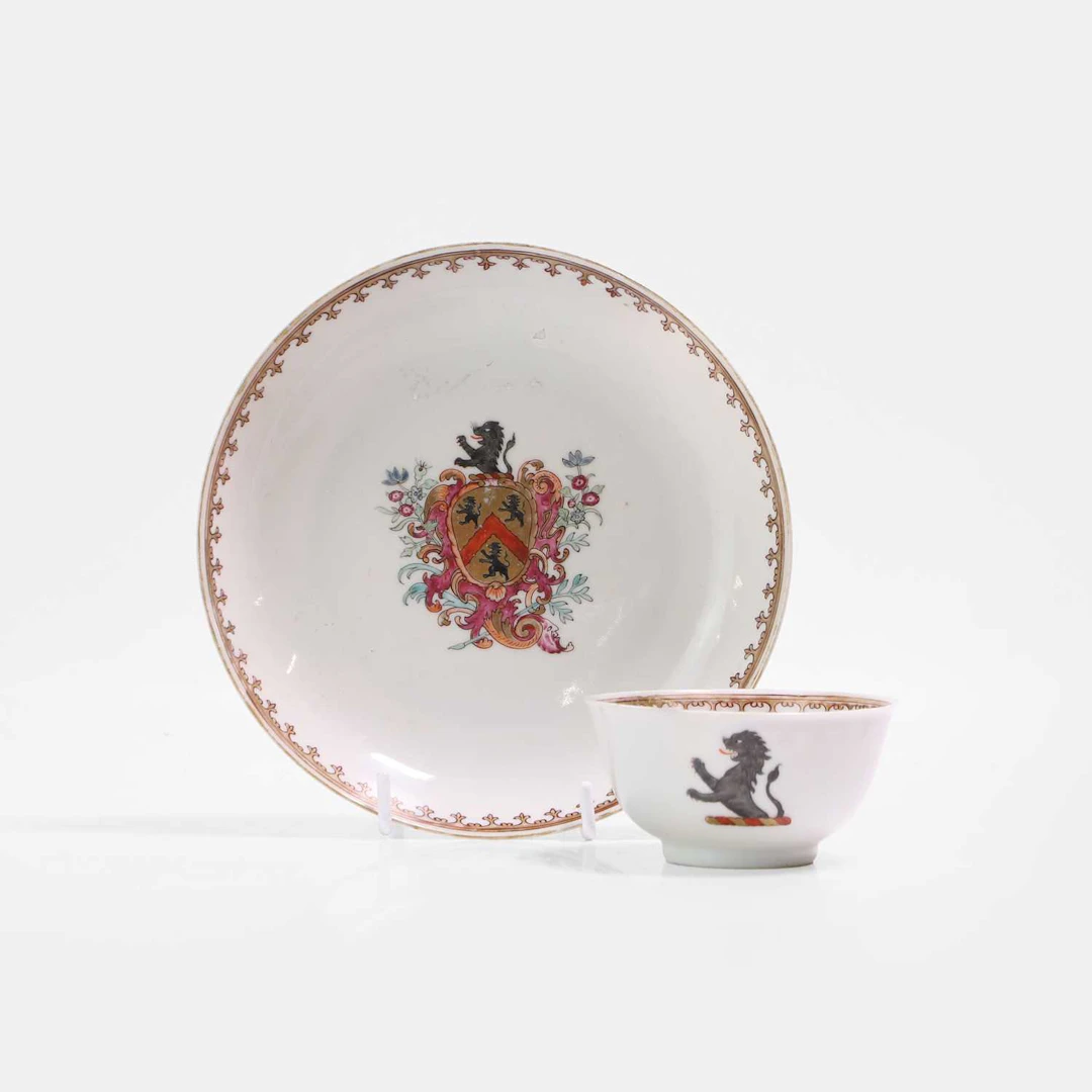 A Chinese export famille rose armorial teacup and saucer 18th century