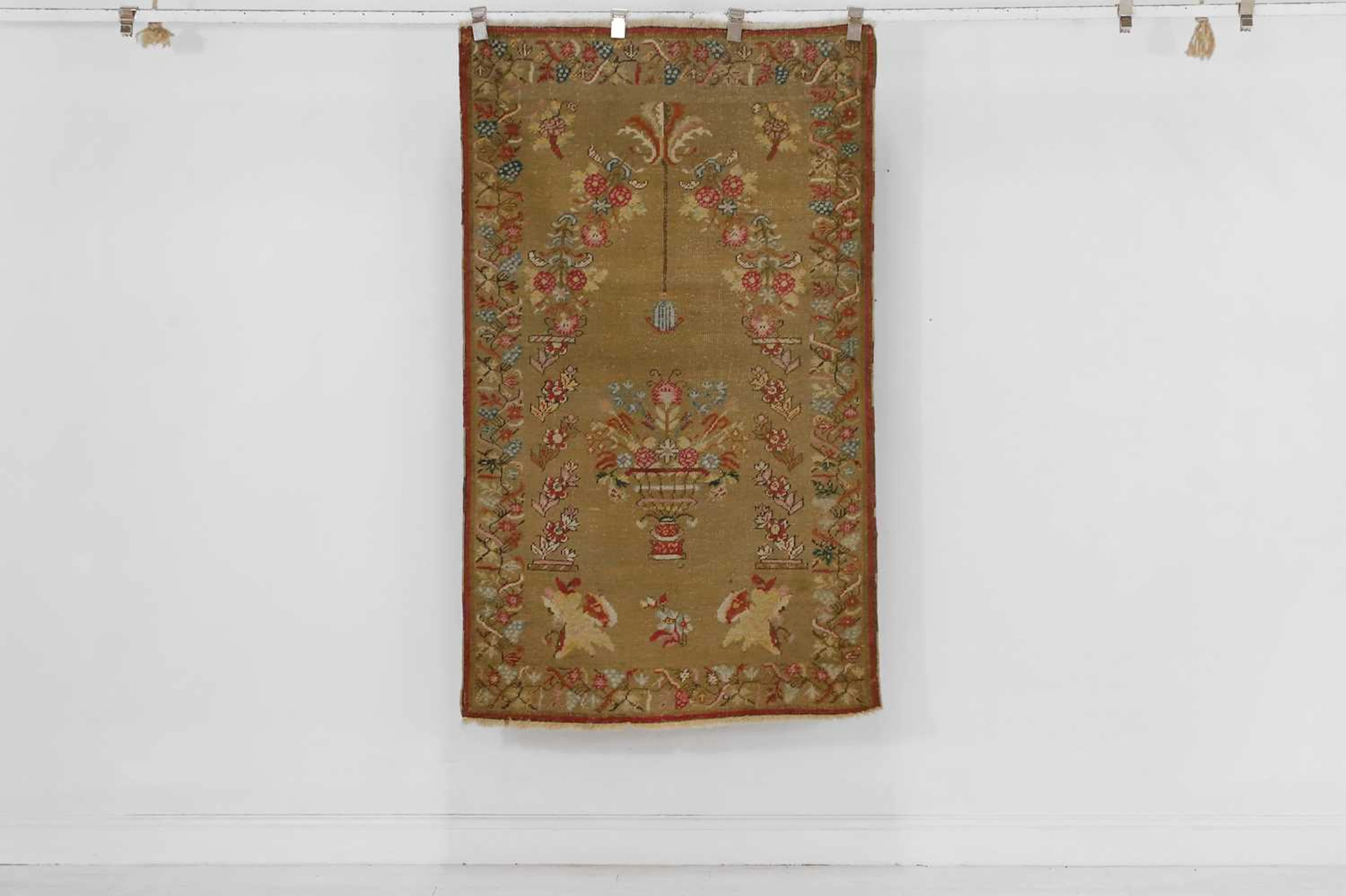 An Oushak wool rug in the European needlepoint style