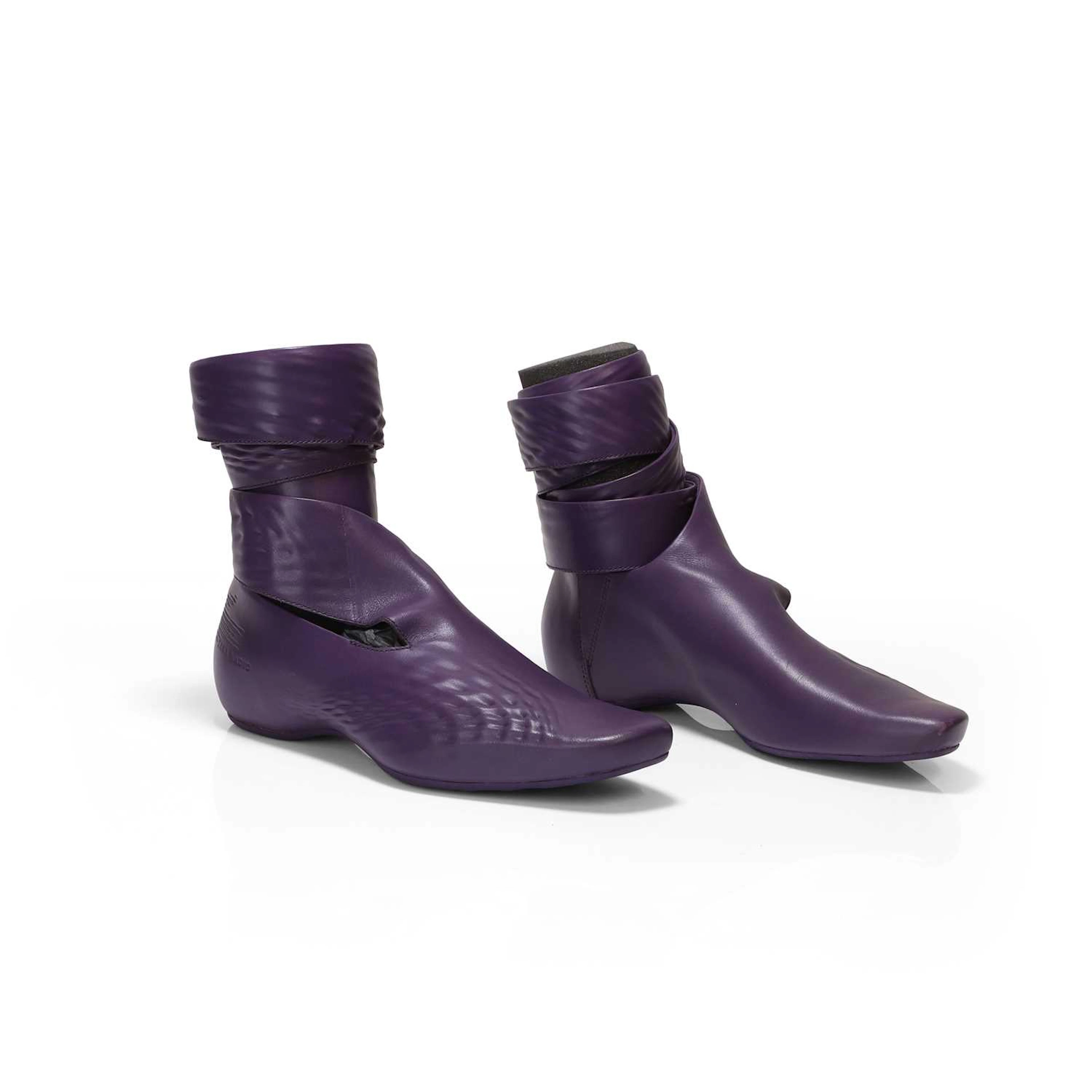 Zaha Hadid (Iraqi / British, 1950-2016) for Lacoste a pair of calf high boots