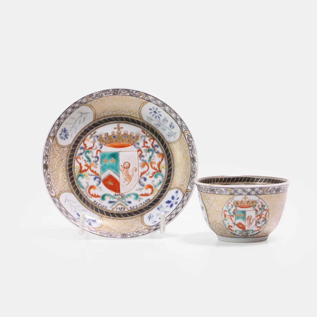 A Chinese export famille rose armorial teacup and saucer 18th century