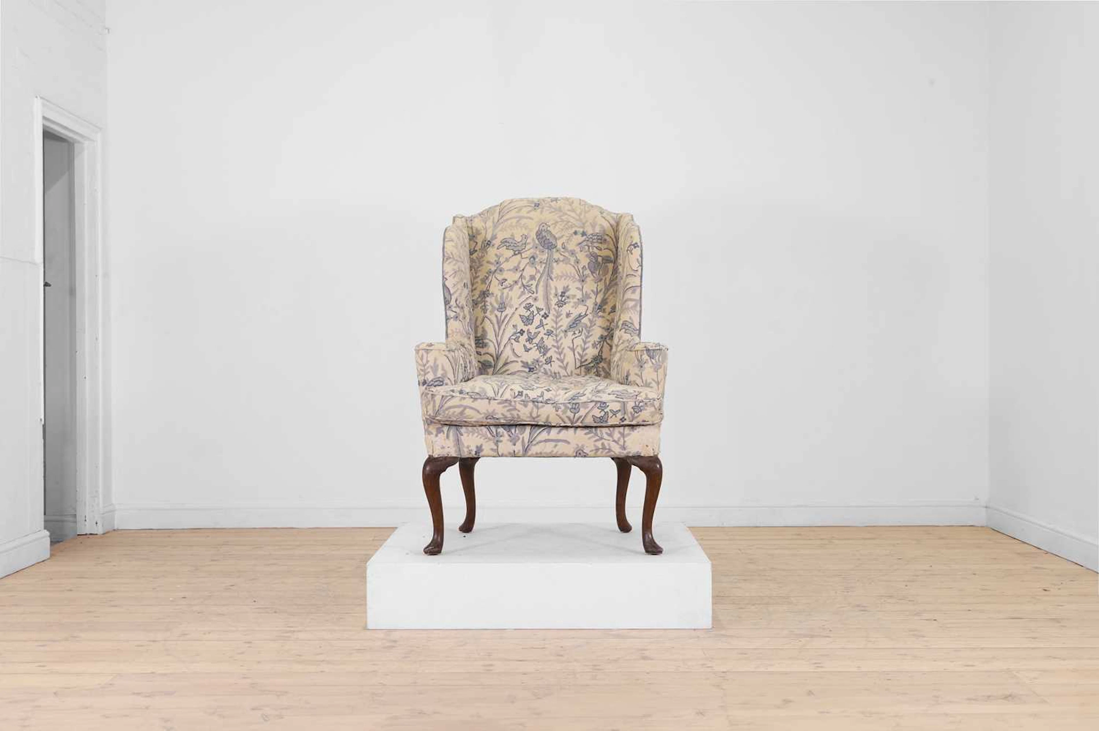 A Queen Anne-style walnut wing armchair 19th century