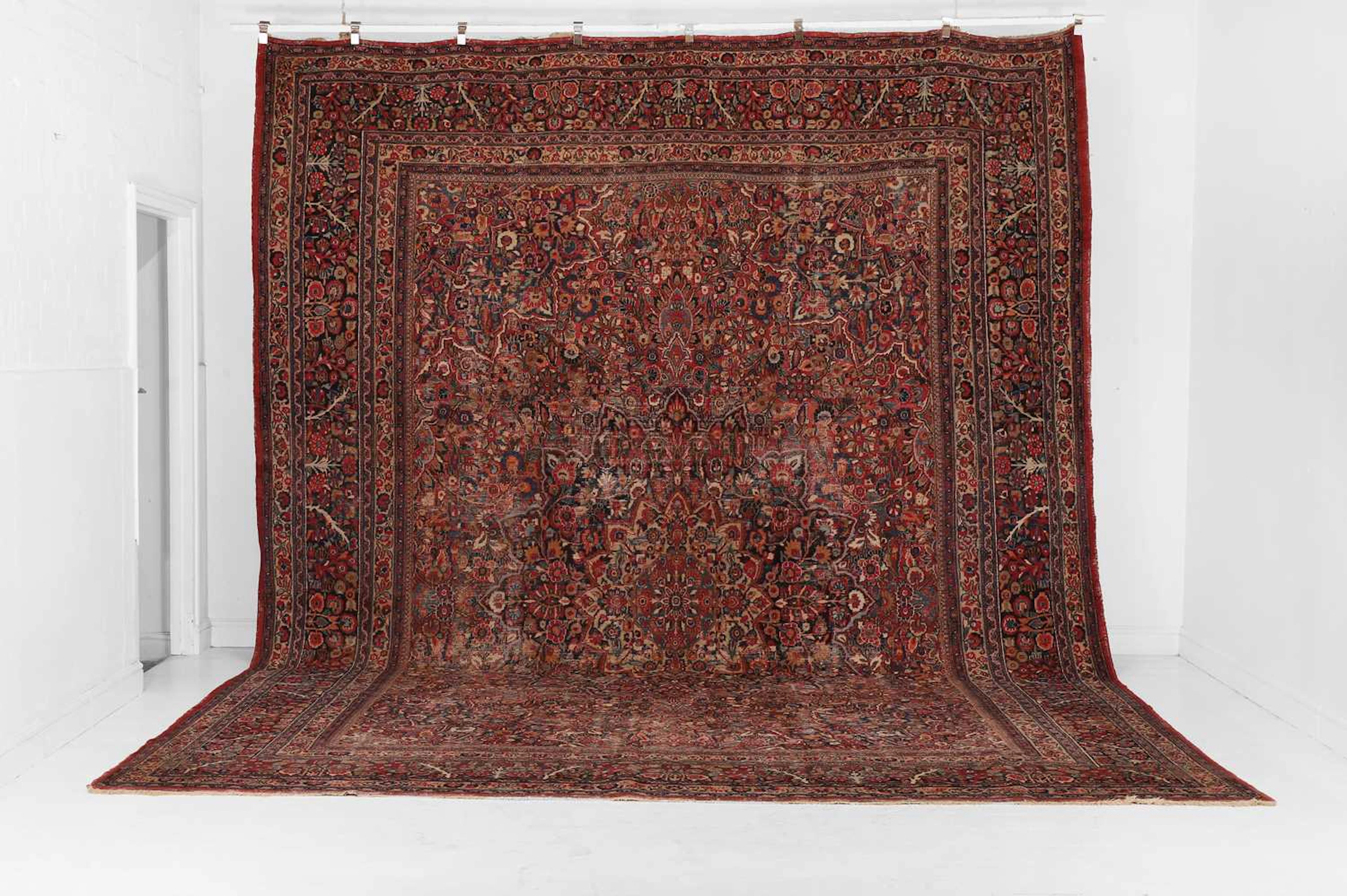 A large Mashad wool carpet 20th century, Persian