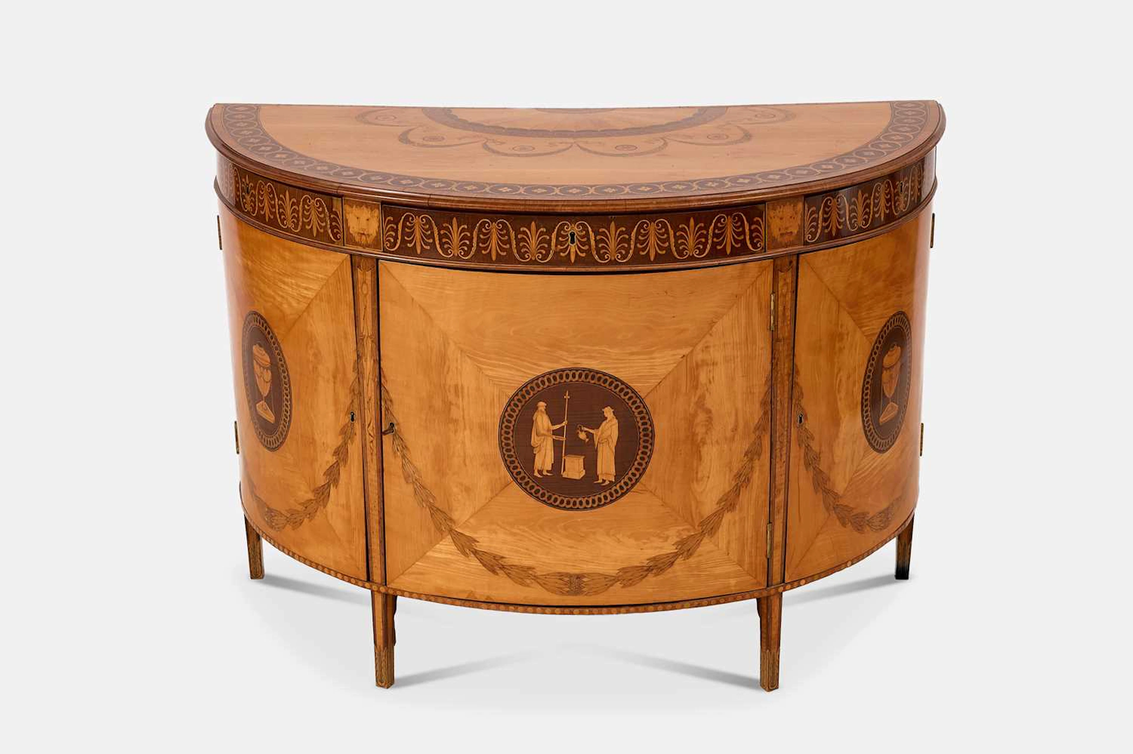 A George III satinwood, harewood and marquetry commode attributed