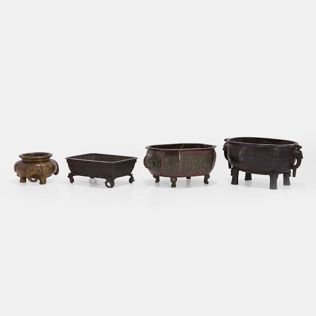 A group of four Japanese bronze koro 20th century