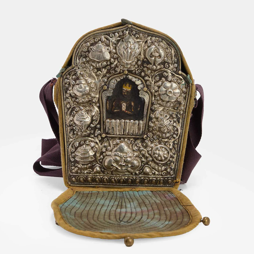 A Tibetan copper and white-metal portable gau shrine 19th century