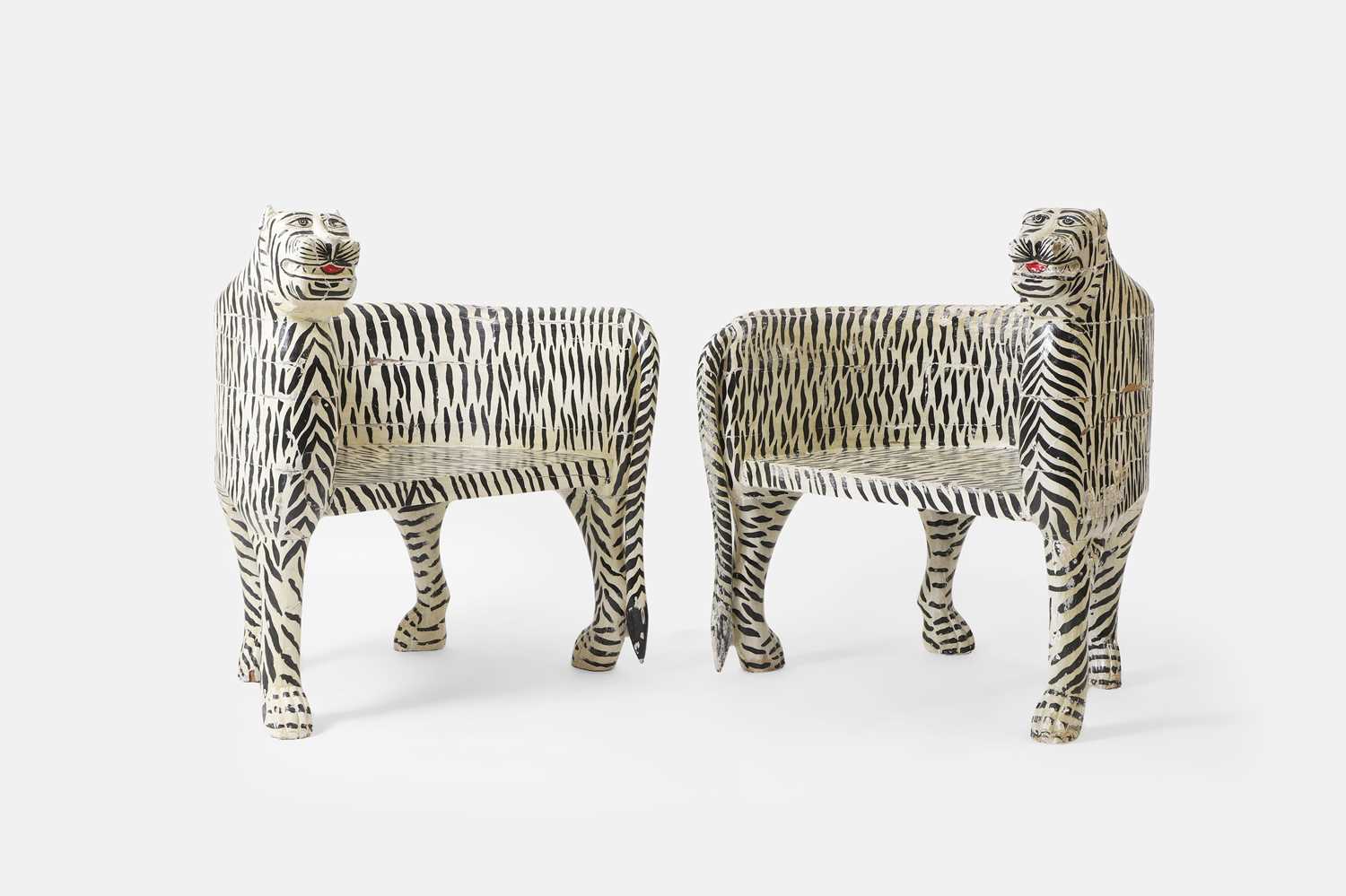 A pair of painted wooden and papier mâché tiger chairs of recent manufacture