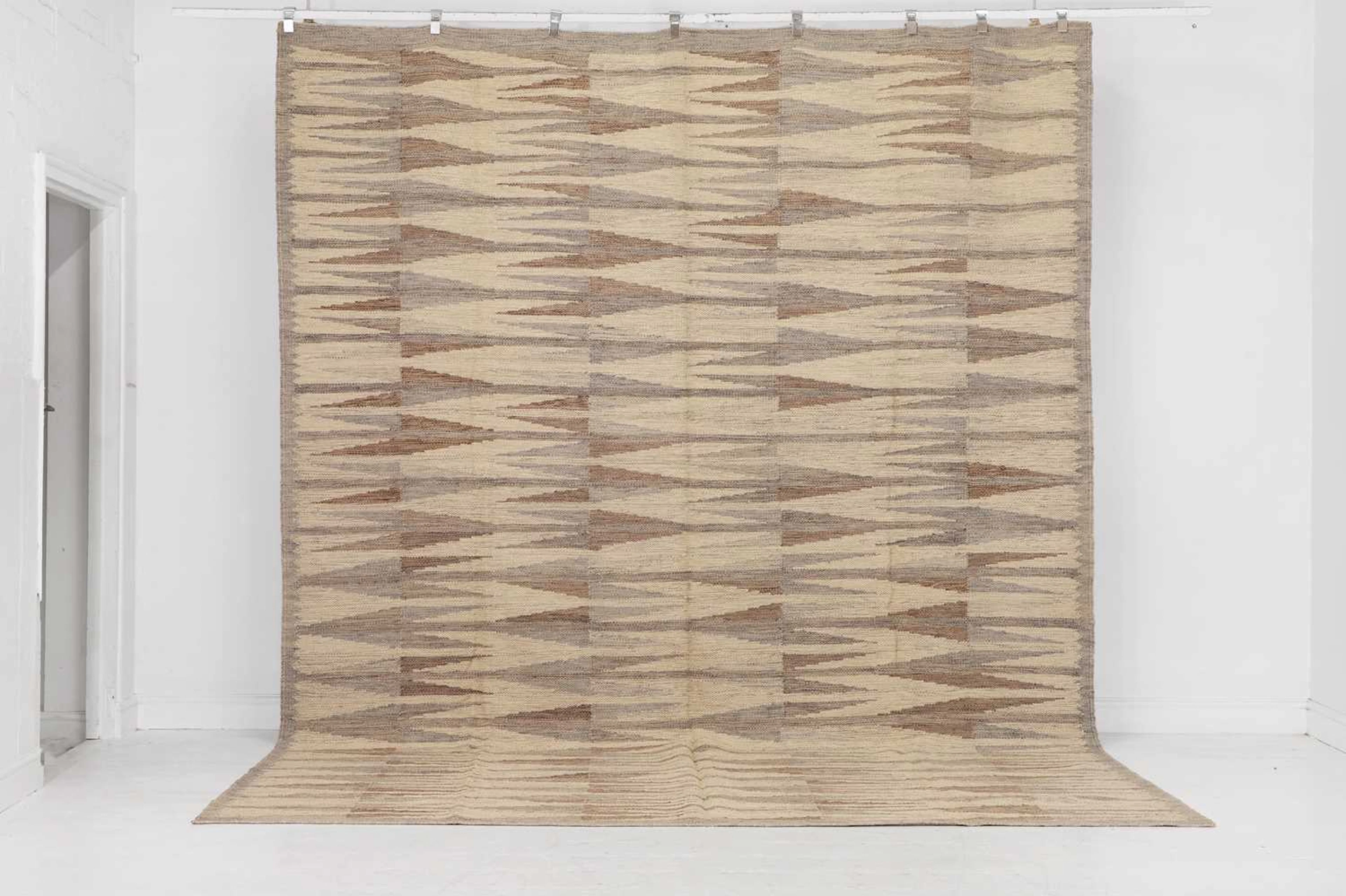 A flat-weave wool carpet of Scandinavian design