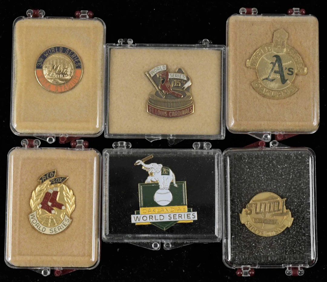 "Lot of (10) World Series press pins from 1983-1989 (EX/MT-NM/MT)
