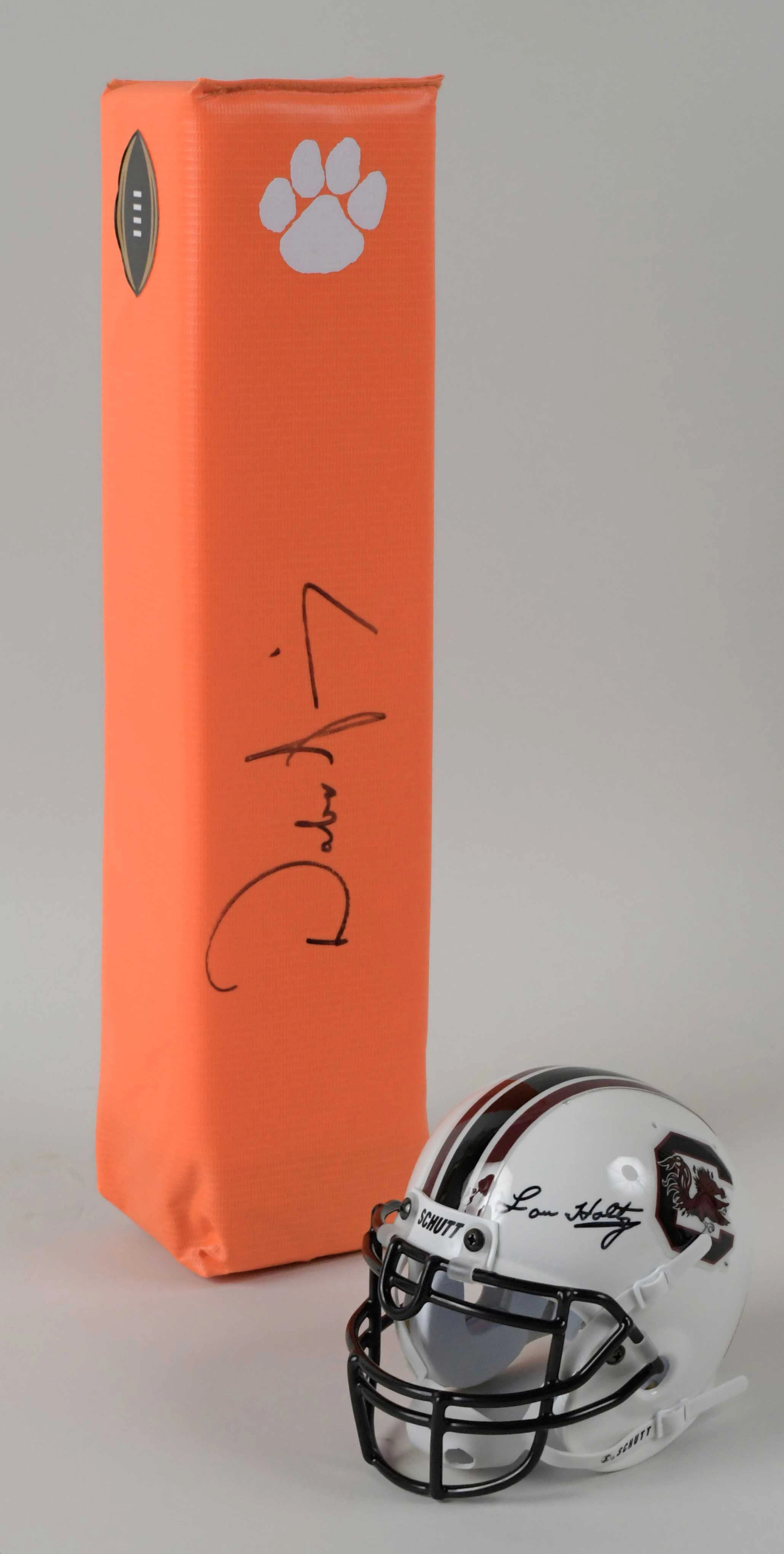 "Lou Holtz signed mini helmet and Dabo Swinney signed pylon (EX/MT-NM/MT)