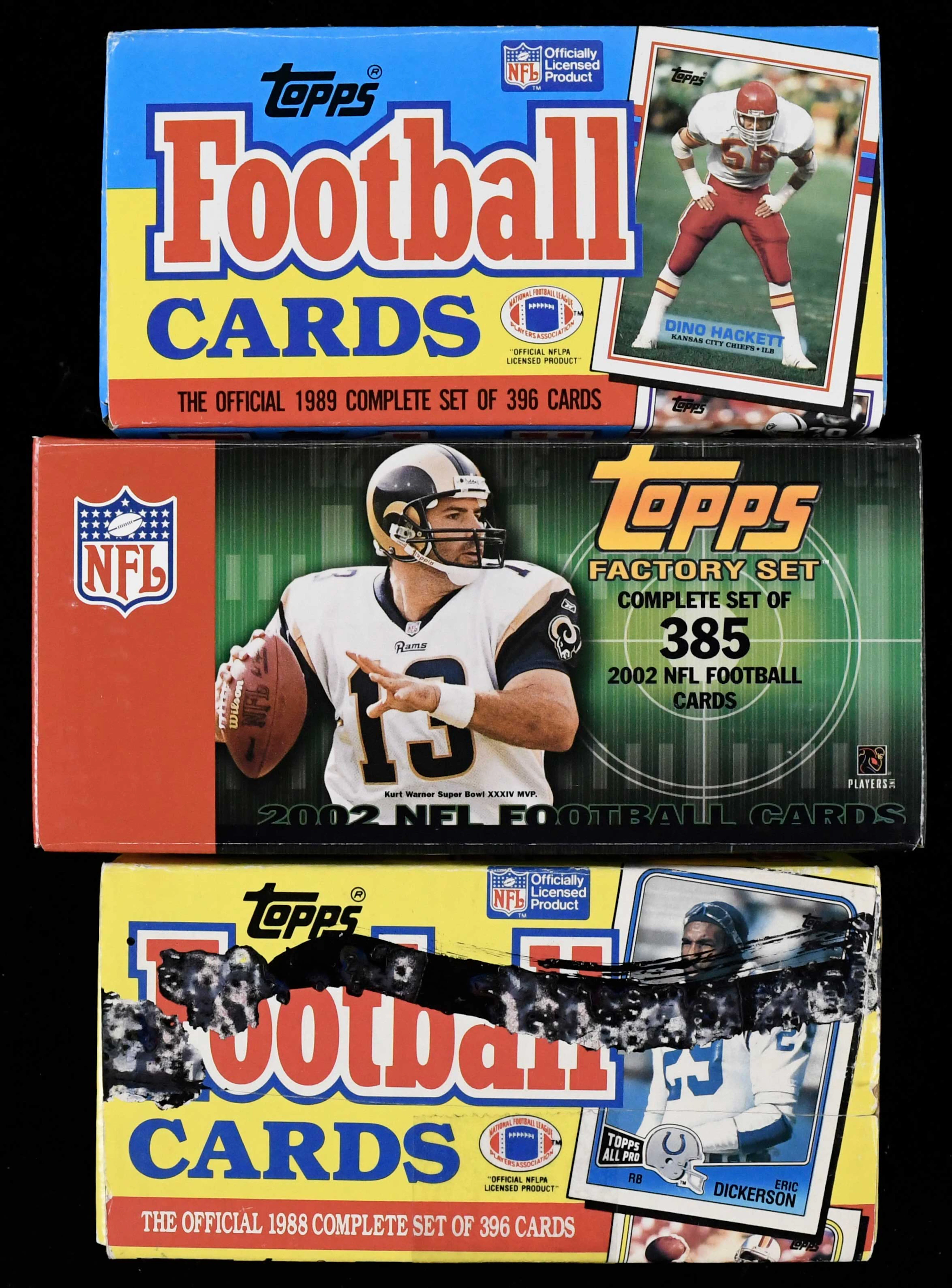 Lot of (5) 1988-2002 Topps football factory sets with two sealed (NM/MT-MT)