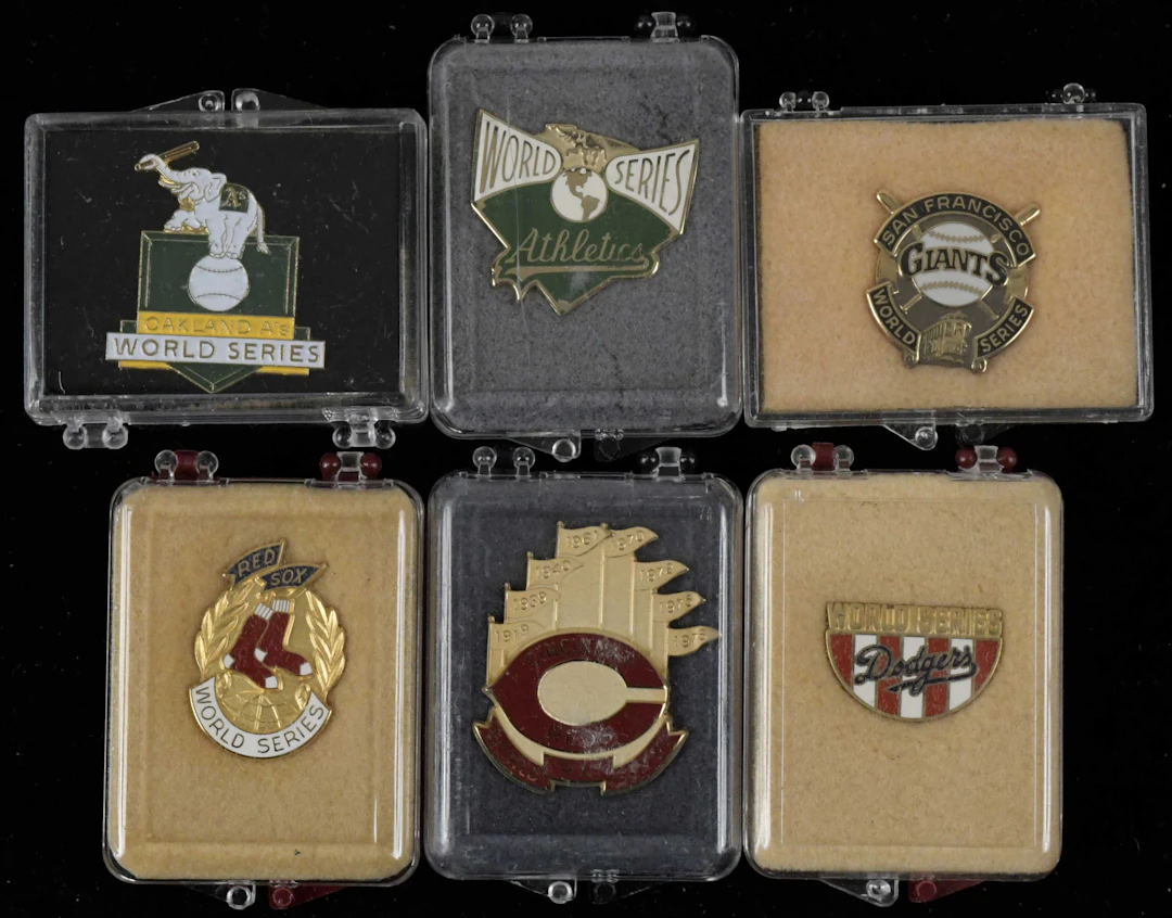 "Lot of (11) World Series press pins from 1983-1991 (EX/MT-NM/MT)