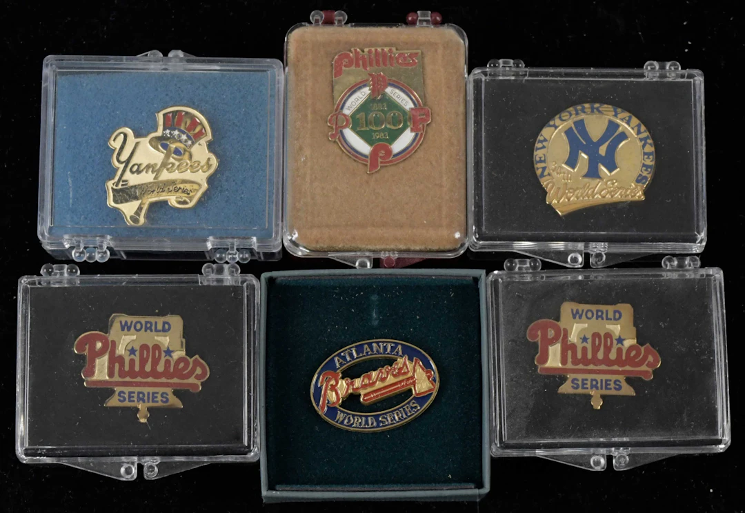 "Lot of (12) World Series press pins from 1983-1998 (EX/MT-NM/MT)