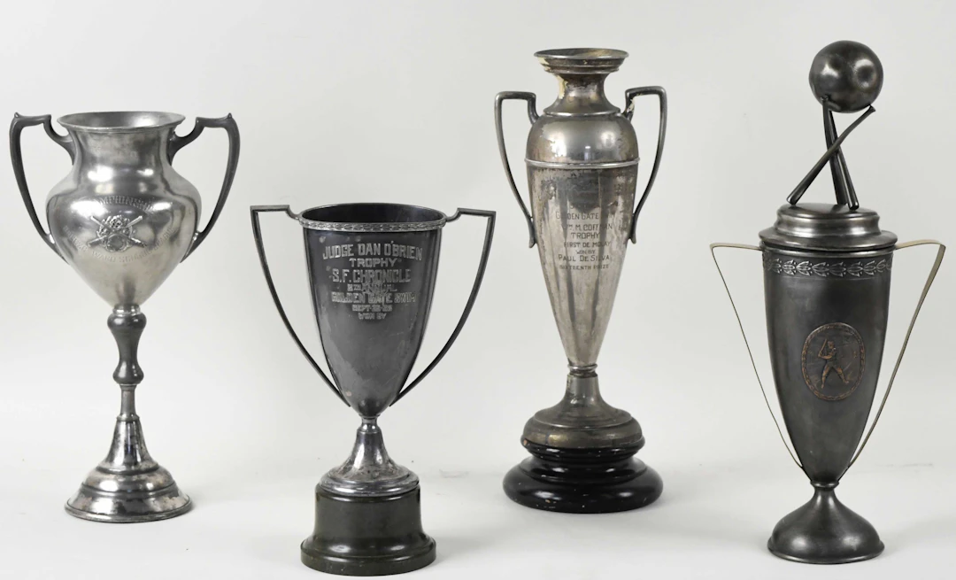 "Lot of (9) vintage trophies from 1918-1934 (GD-VG/EX)