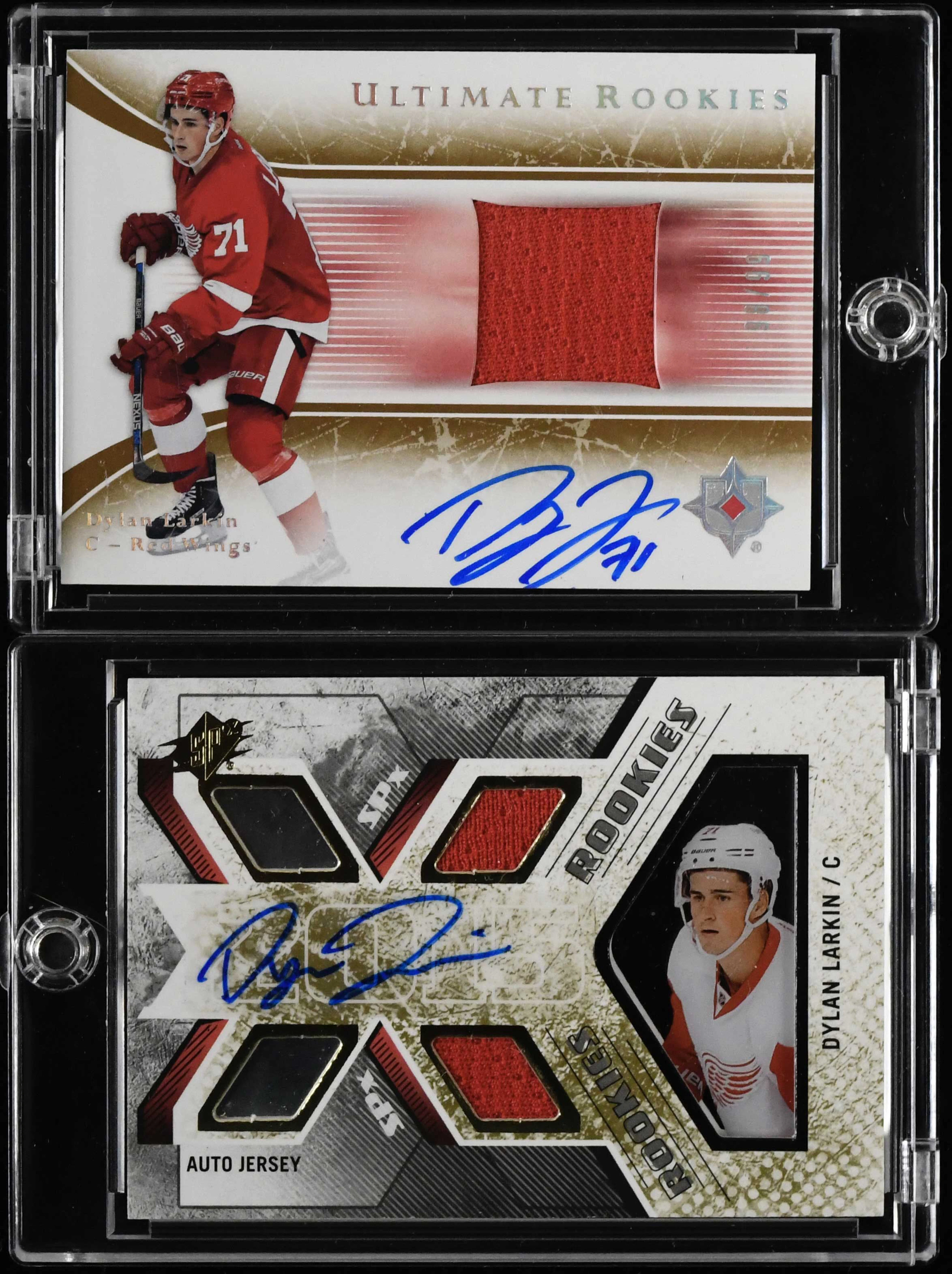"Lot of (2) Dylan Larkin signed serial numbered rookie relic cards (NM-NM/MT)