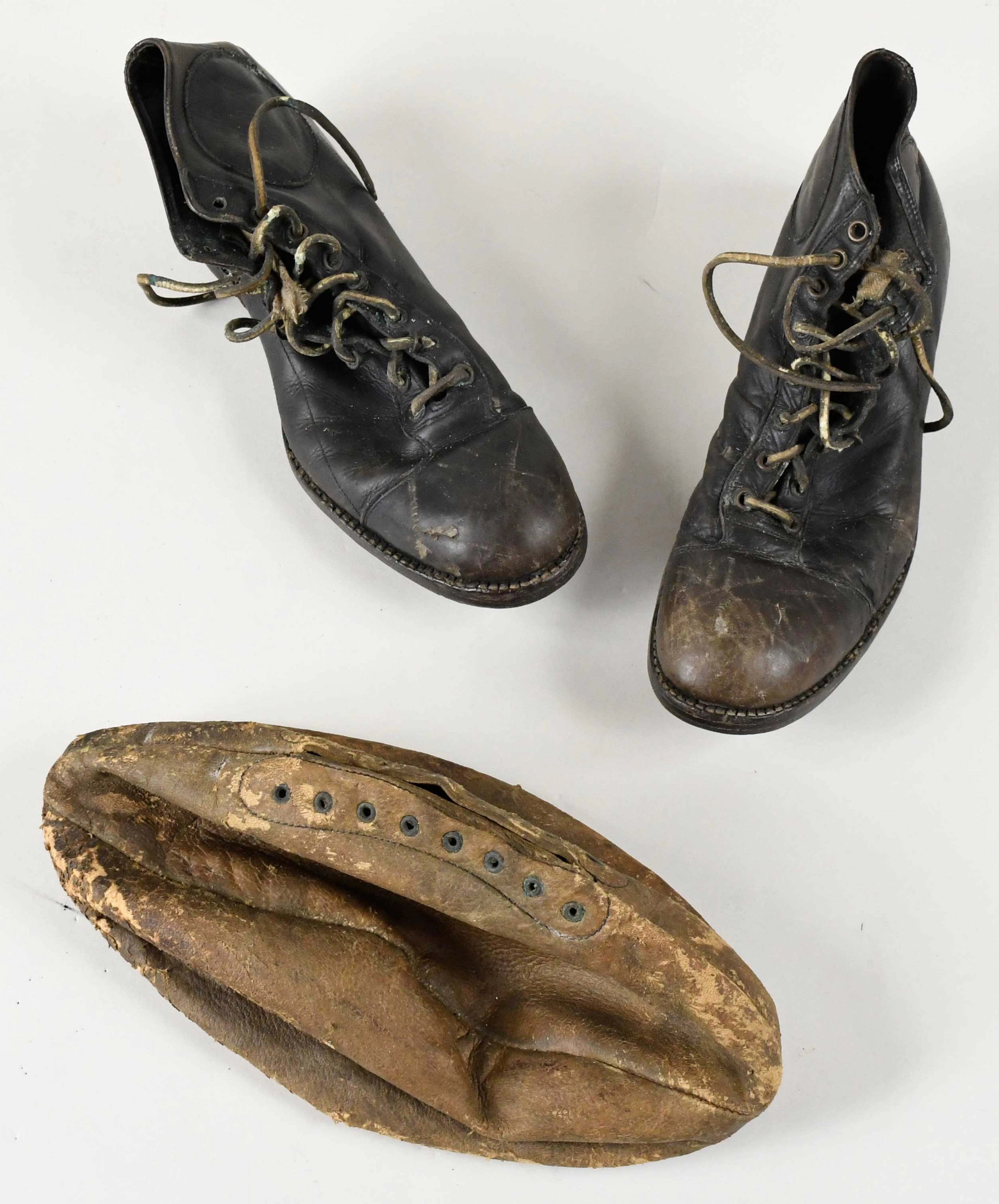 "Vintage rugby ball and cleats