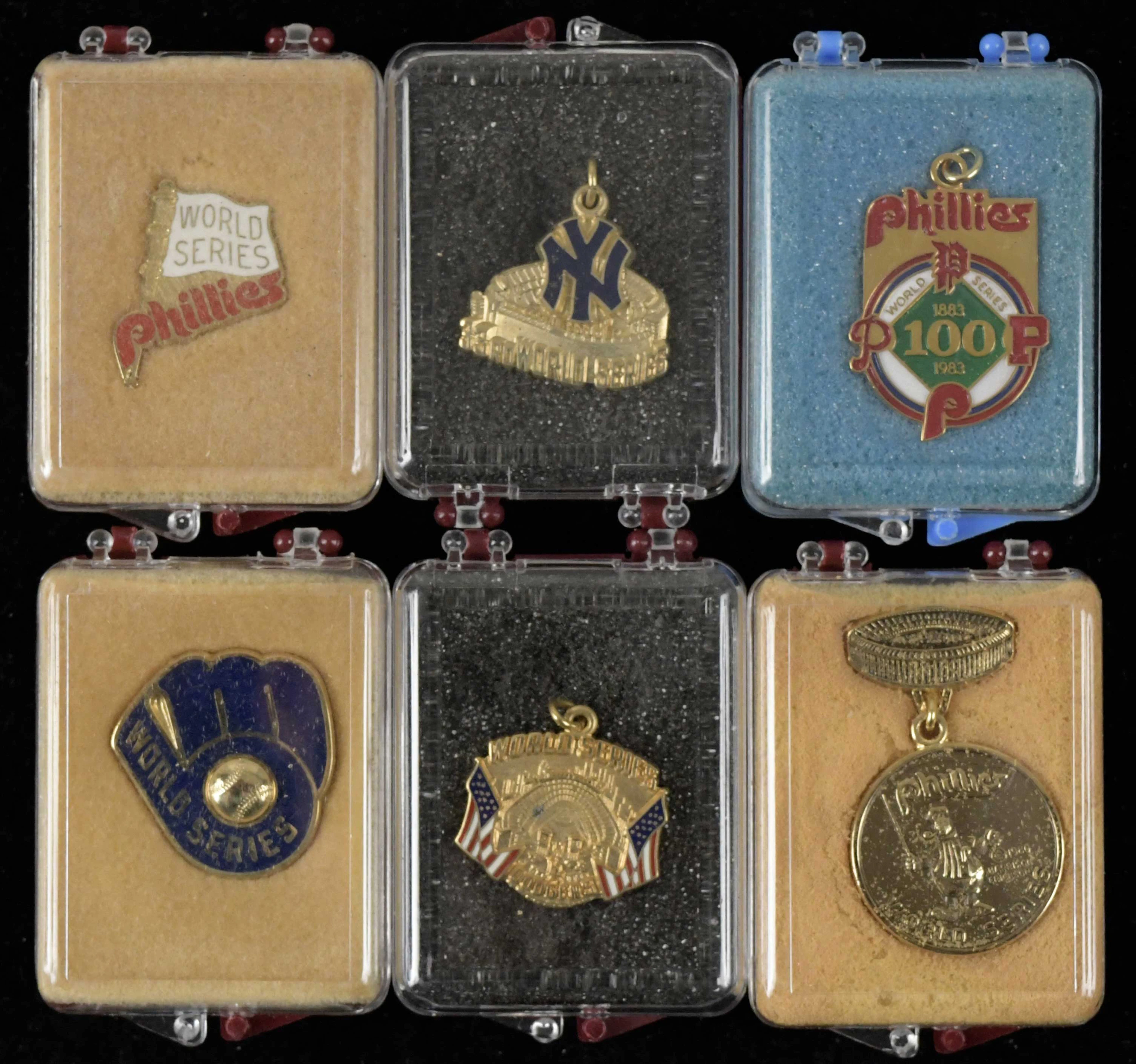 "Lot of (8) World Series press pins and charms from 1980-1984 (EX-NM/MT)