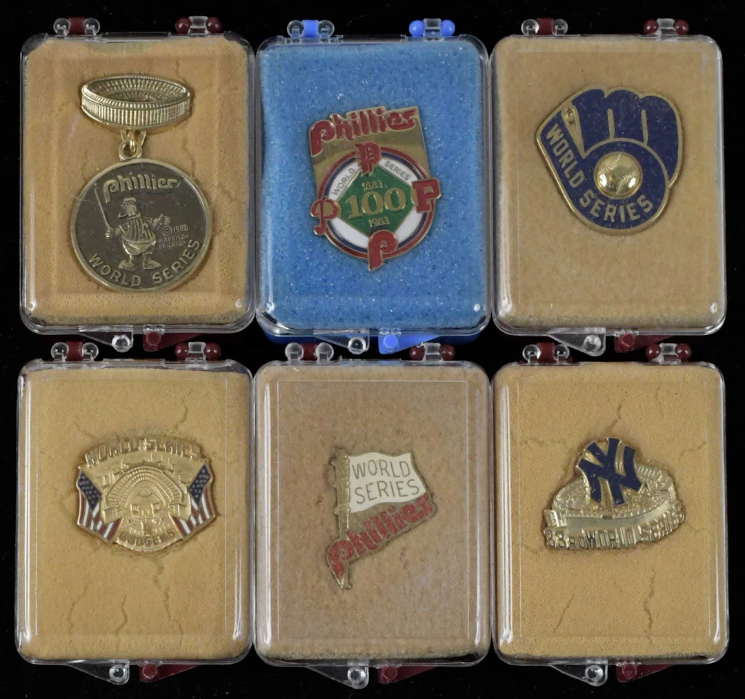 "Lot of (7) World Series press pins from 1980-1983 (EX/MT-NM/MT)