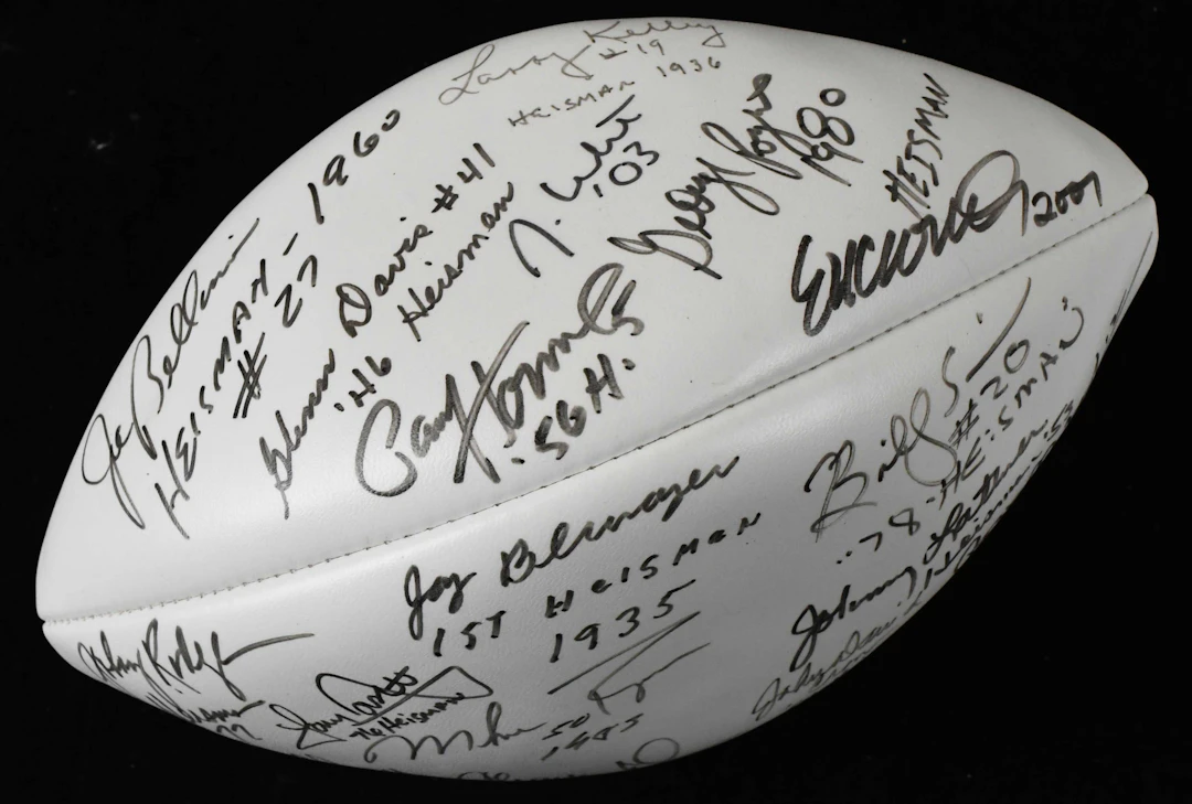 "Heisman Trophy winners multi-signed and inscribed football (NM)
