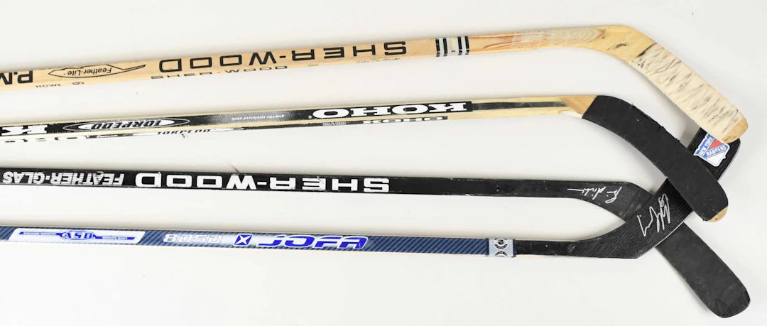 "Lot of (13) pro stock & replica hockey sticks