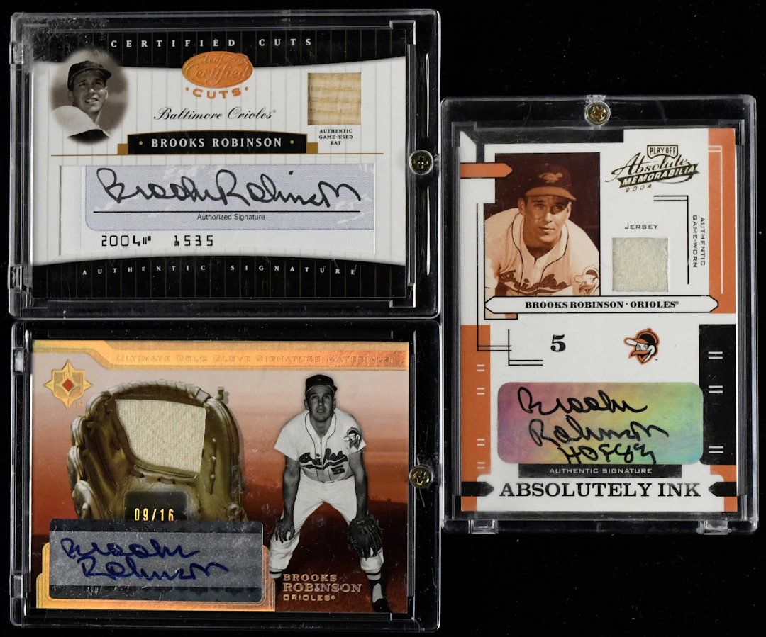 "Lot of (3) Brooks Robinson signed serial numbered relic insert cards (NM-NM/MT)