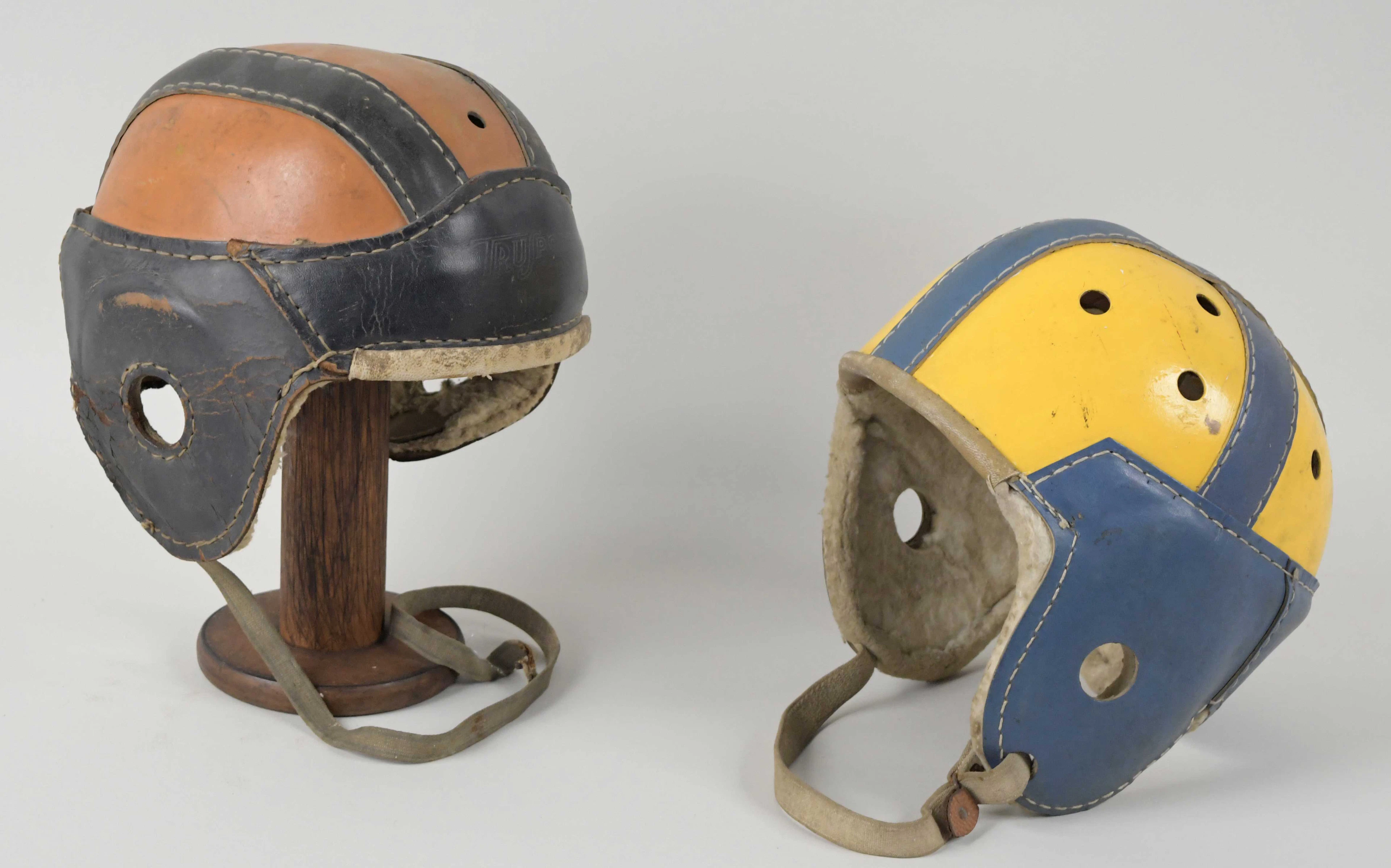 "Pair of leather football helmets
