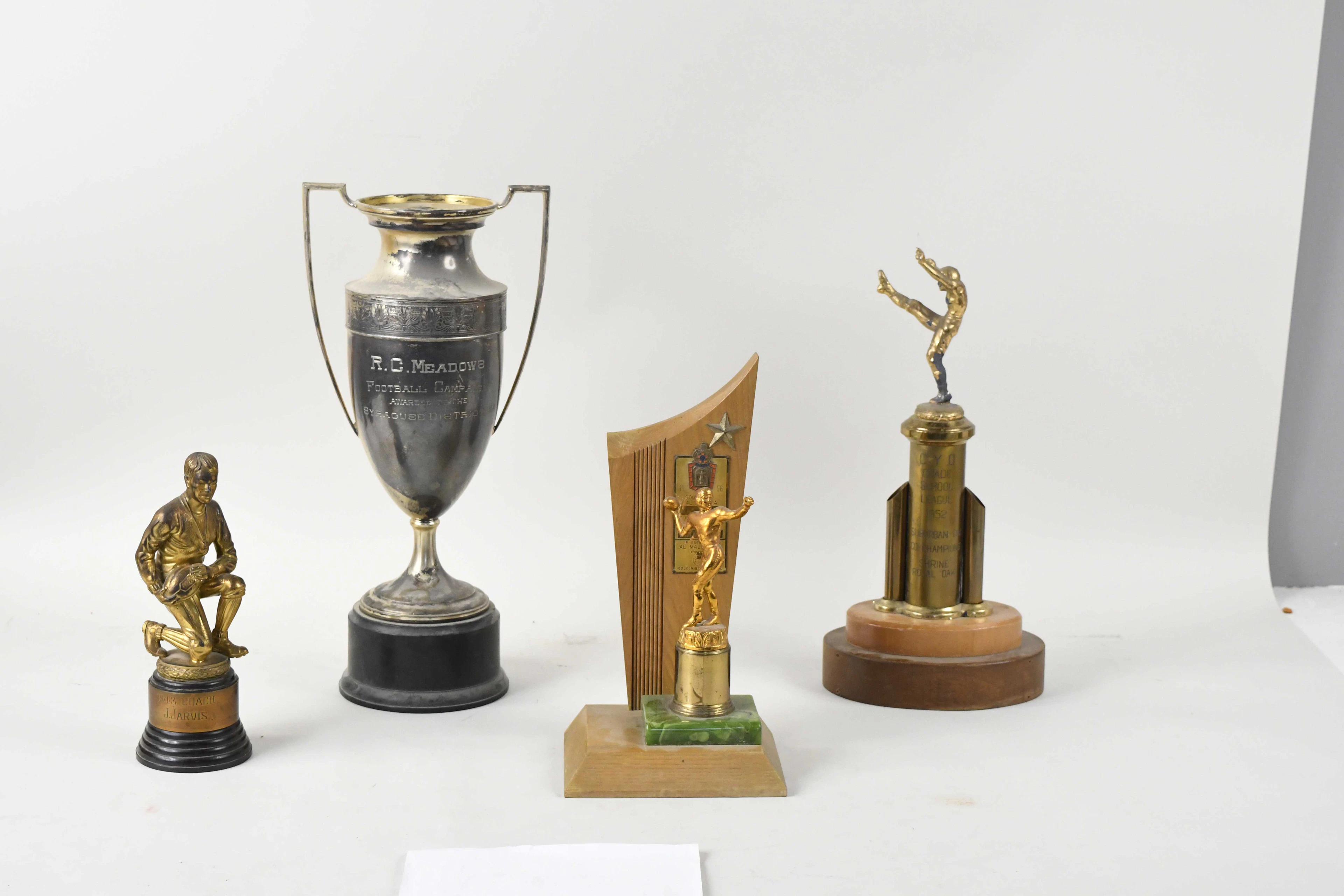 "Lot of (5) football trophies from 1938-1956 (GD-VG/EX)