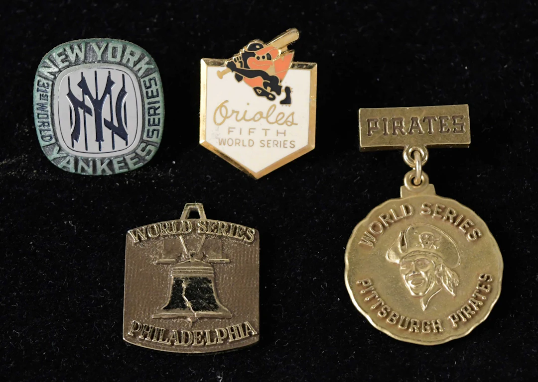 "Lot of (5) World Series press pins and charm from 1974-1979 (VG-NM/MT)
