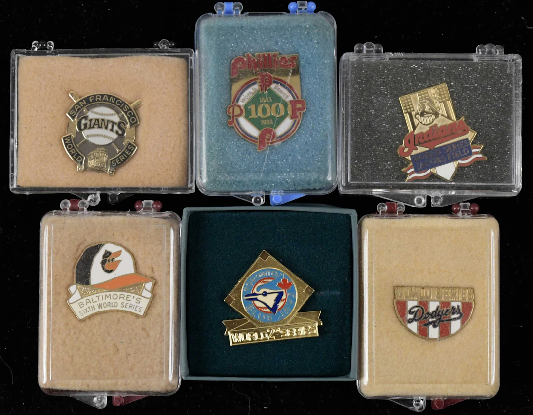 "Lot of (11) World Series press pins from 1983-1995 (EX/MT-NM/MT)