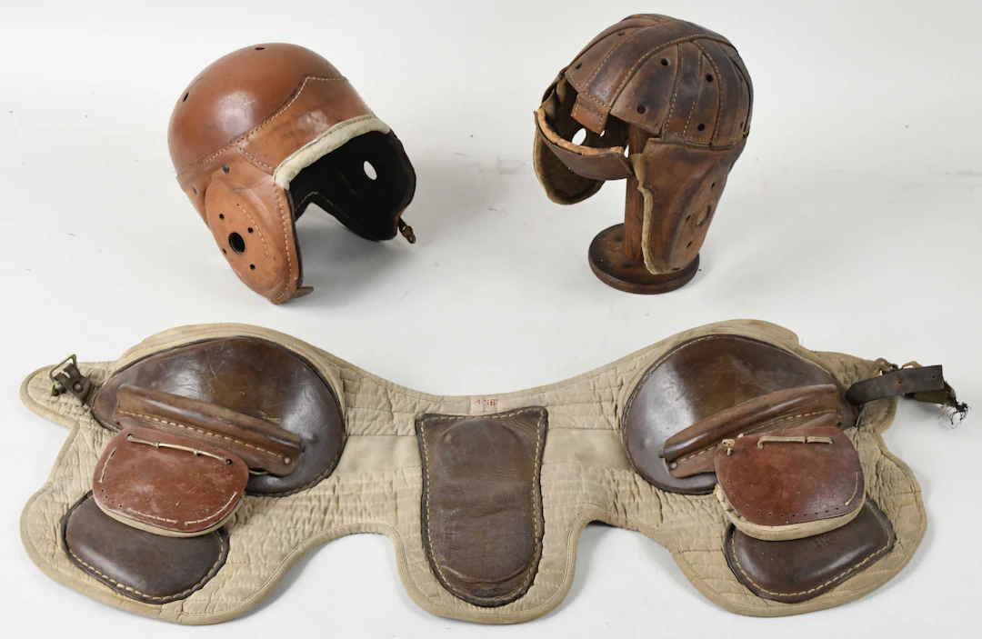 "Lot of (2) vintage football helmets plus hip/thigh pads