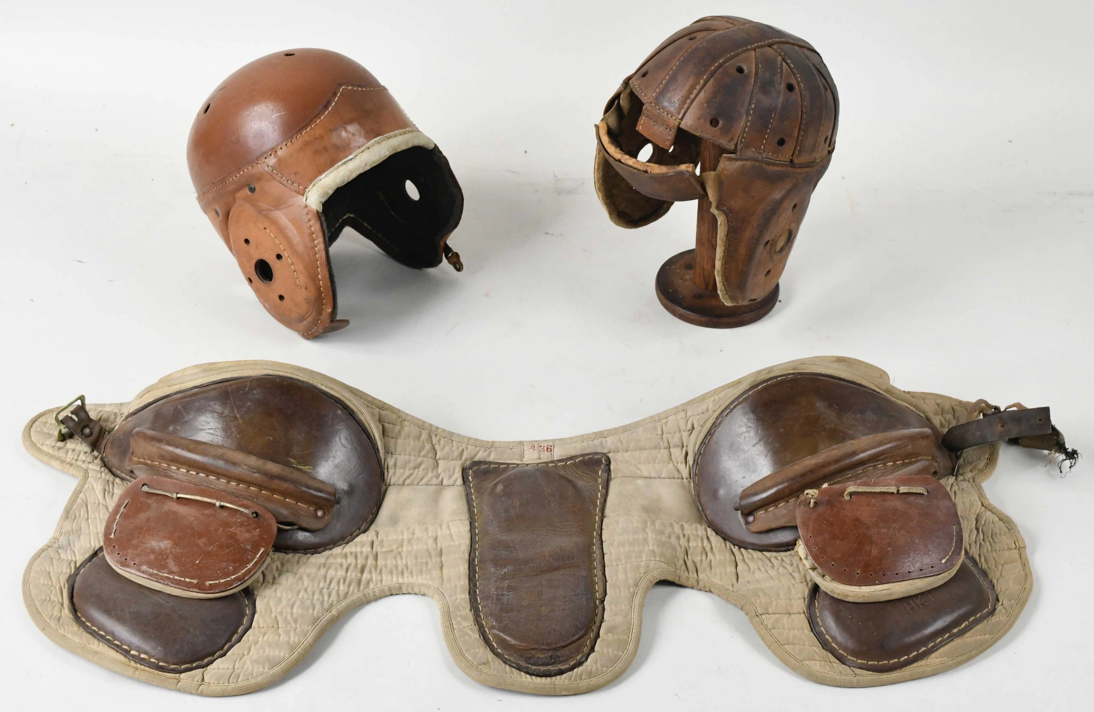 "Lot of (2) vintage football helmets plus hip/thigh pads