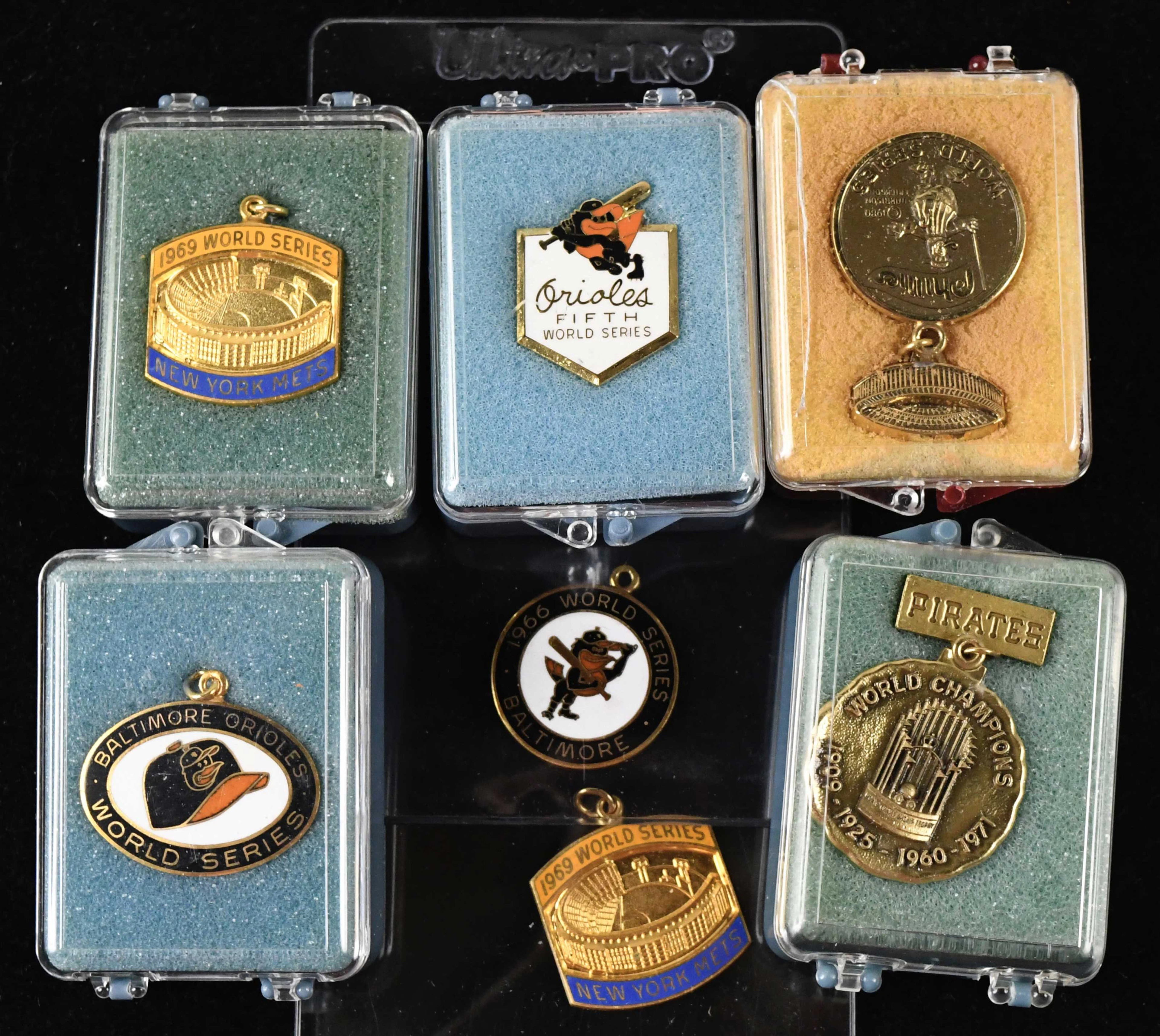 "Lot of (7) World Series press pins and charms from 1966-1980 (VG/EX-NM/MT)