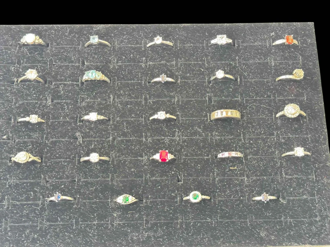 Collection of twenty four silver gem set rings.