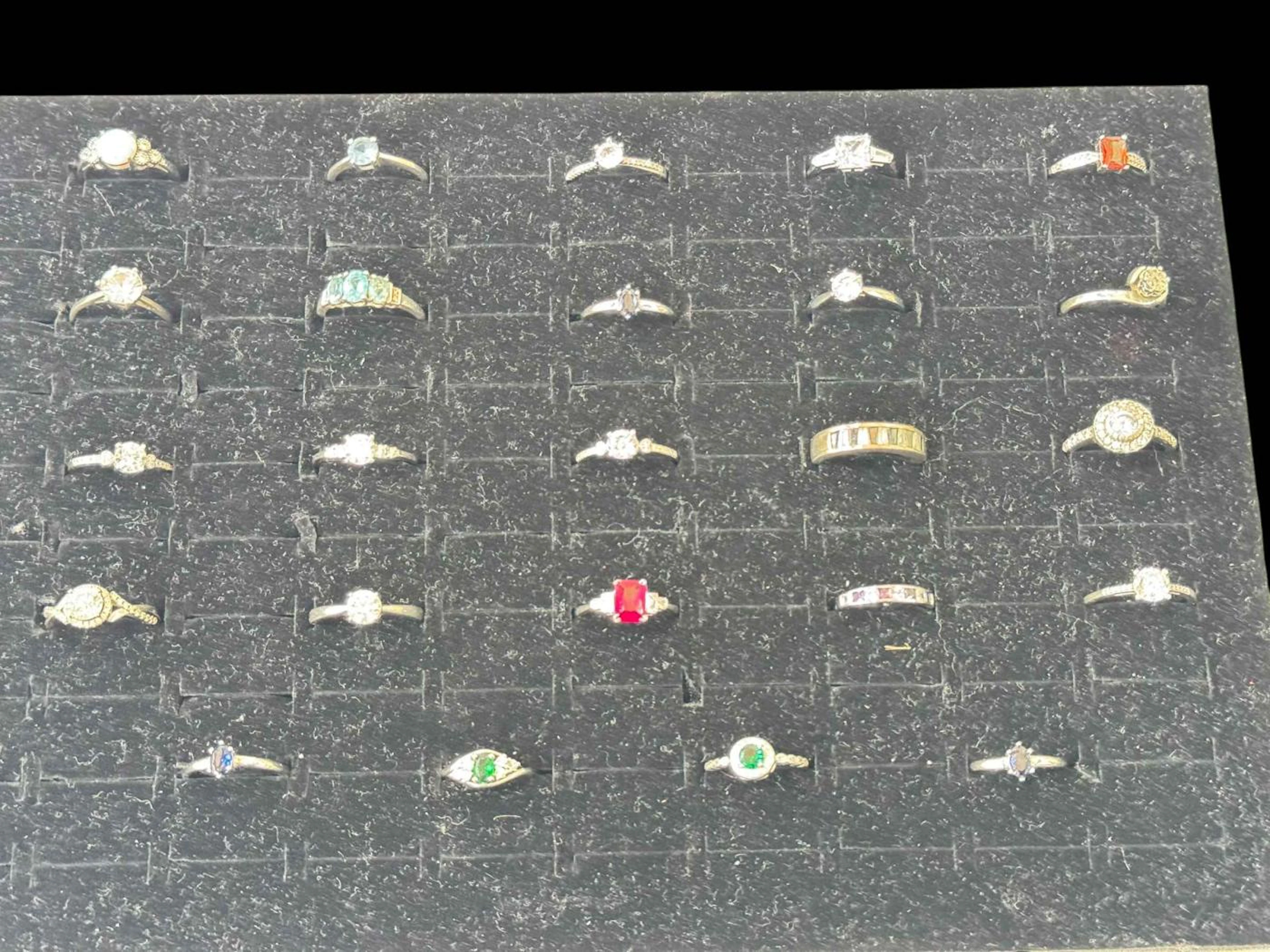 Collection of twenty four silver gem set rings.