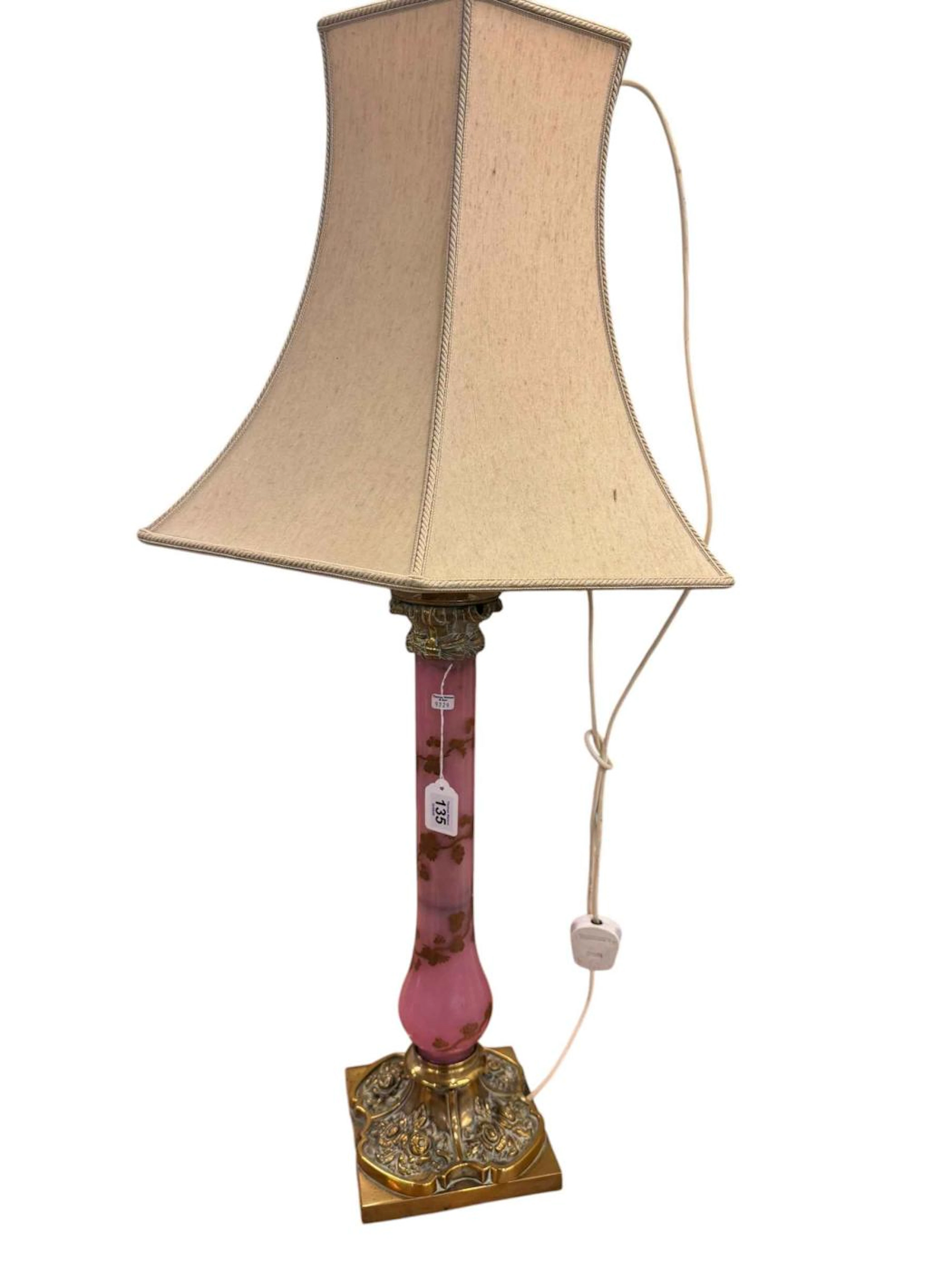 Vintage pink glass and ornate brass table lamp with cream lamp shade.