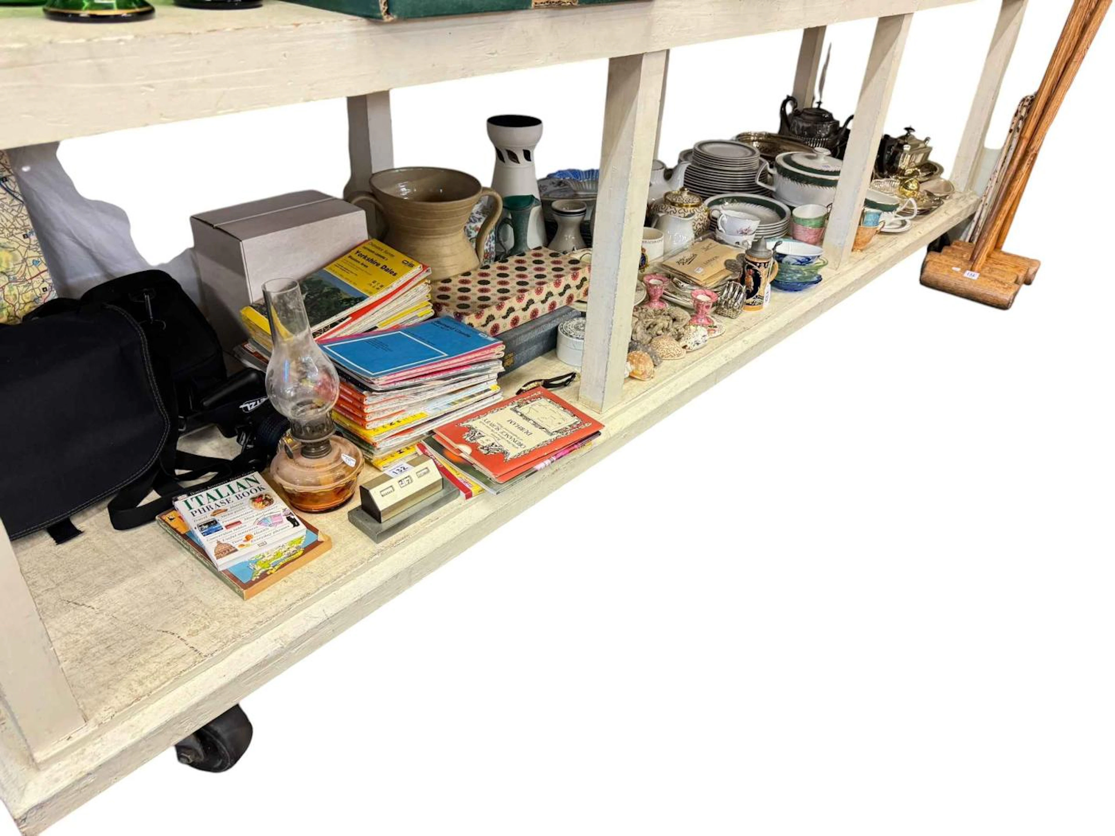 Full shelf of china, silver plated ware, Ordnance Survey maps, camera