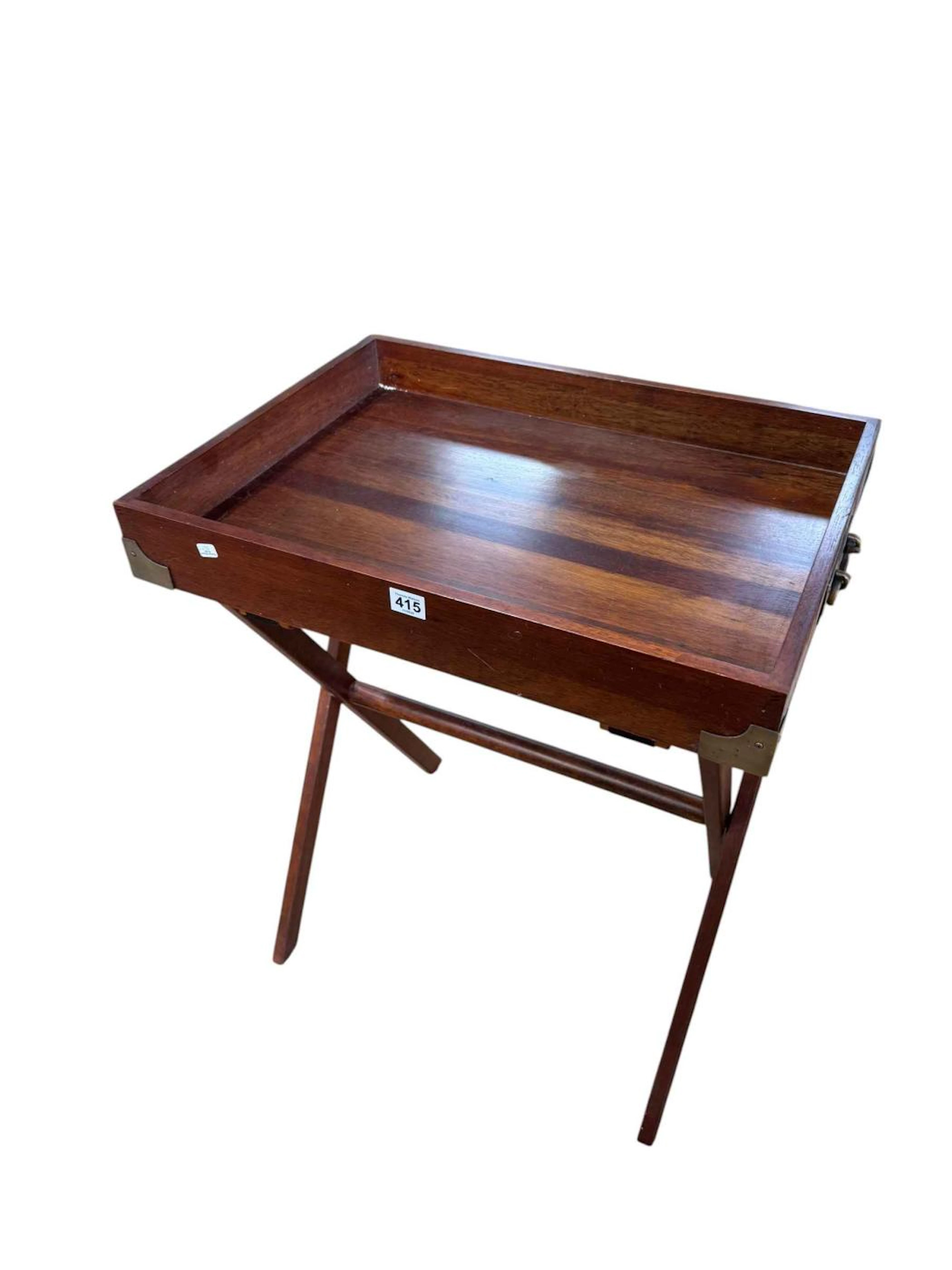 Mahogany brass bound butlers tray on folding stand.
