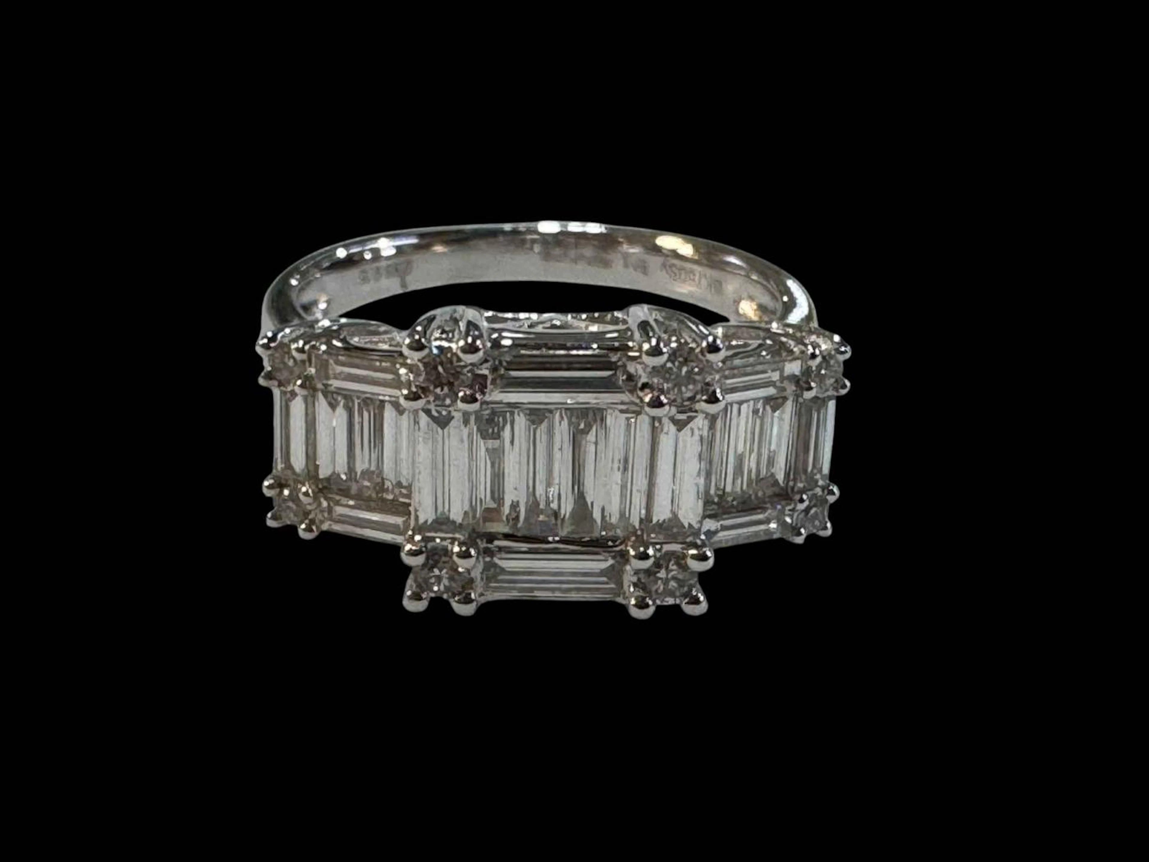18 carat white gold diamond ring, set with twenty baguettes and eight