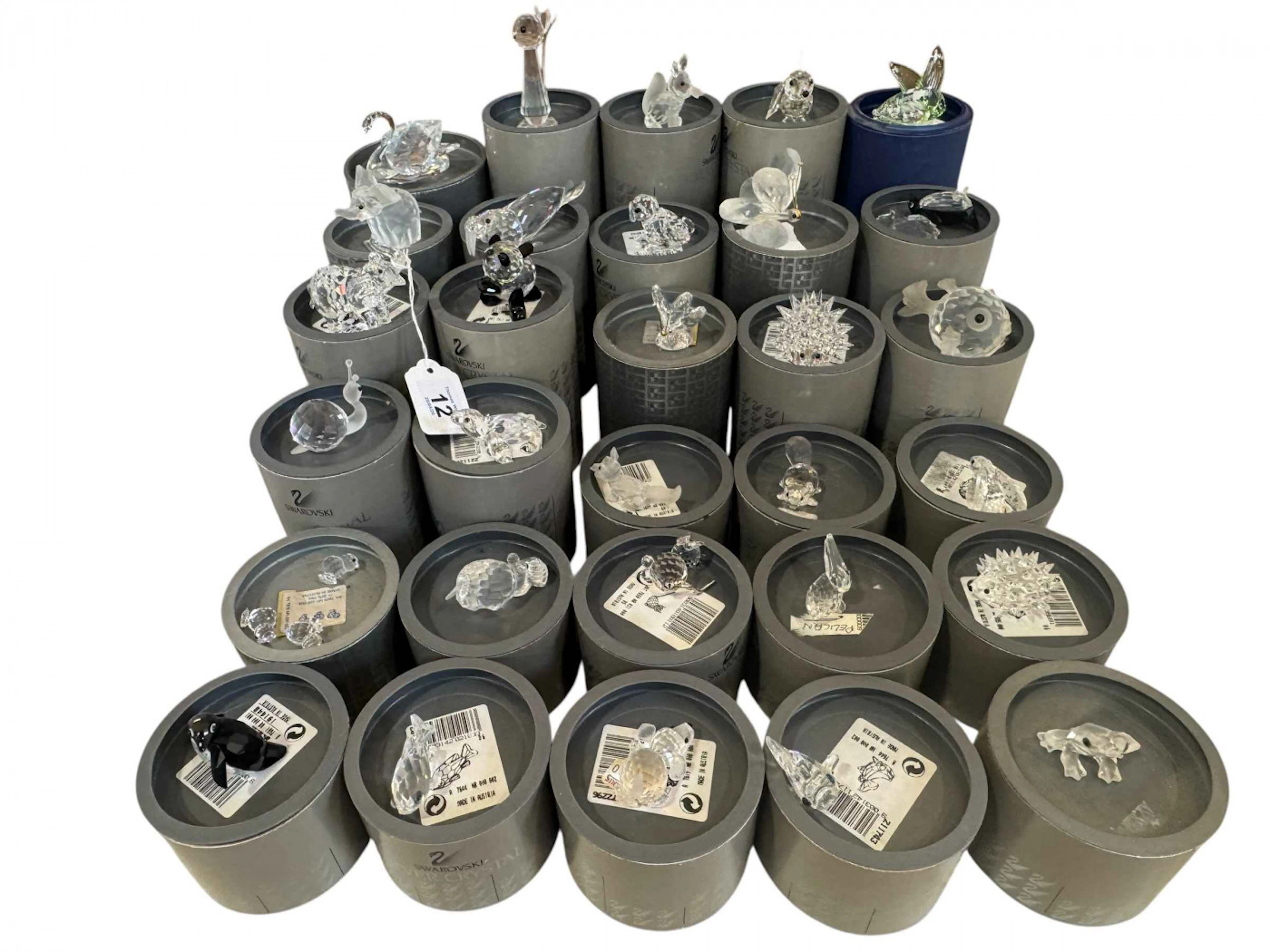Swarovski; Thirty small and medium pieces with boxes.