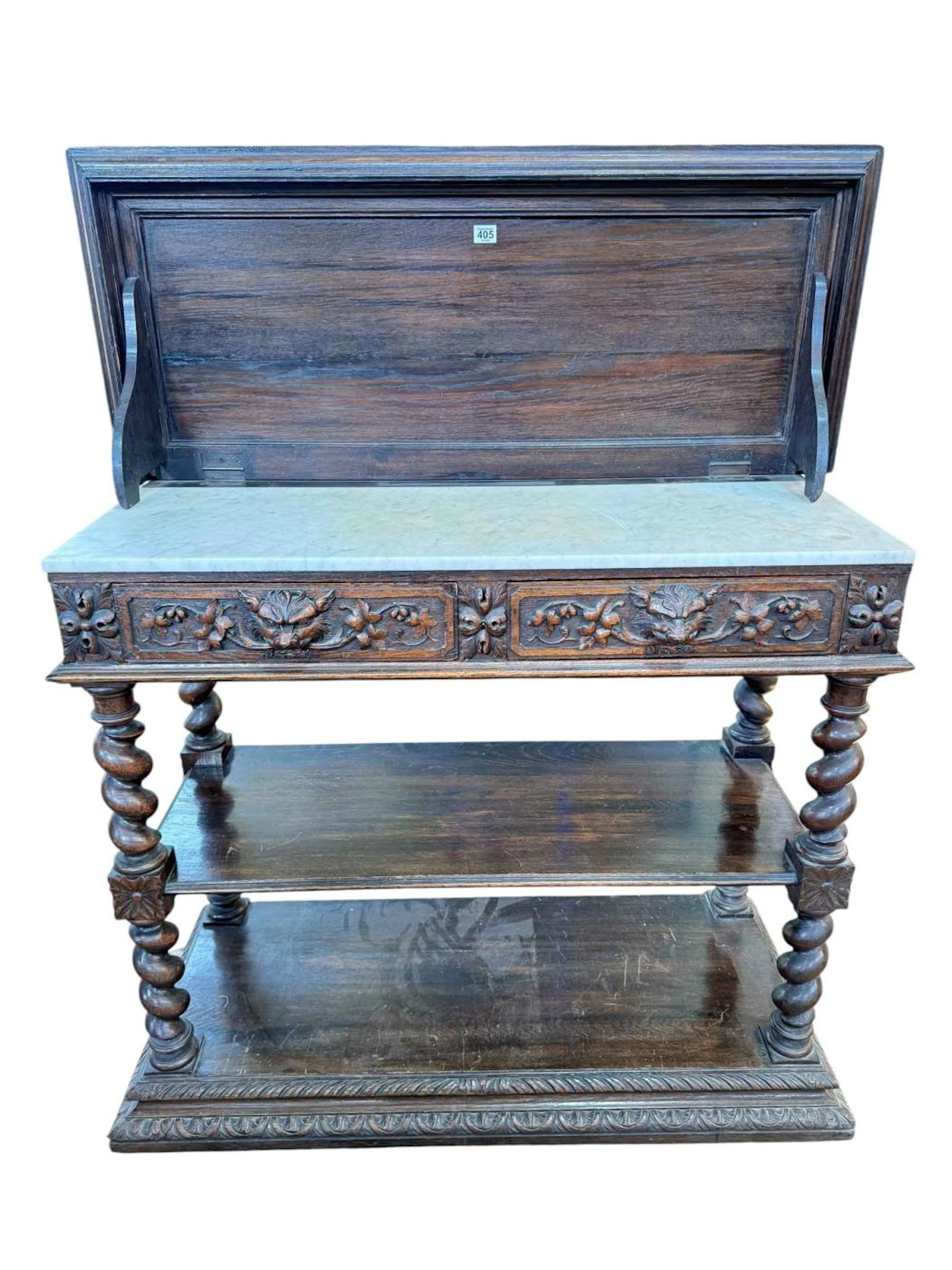 Carved oak buffet raised on four barley twist columns, having two